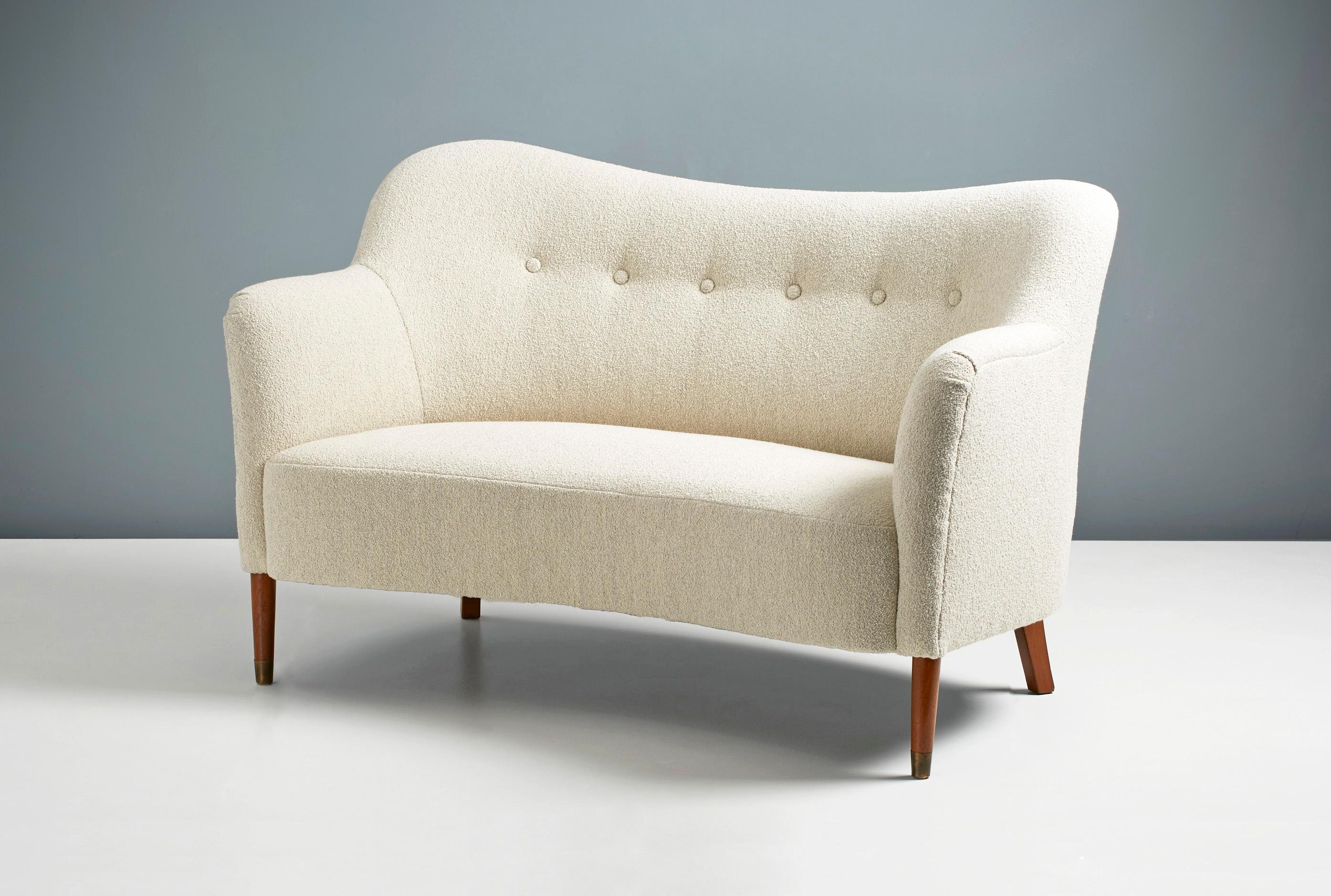 Danish Cabinetmaker

Curved Loveseat, c1950s

Two person love-seat sofa in the manner of Finn Juhl. Produced by an anonymous Danish cabinetmaker c1950s. The sofas has oak legs with patinated brass shoes and has been reupholstered in a stone