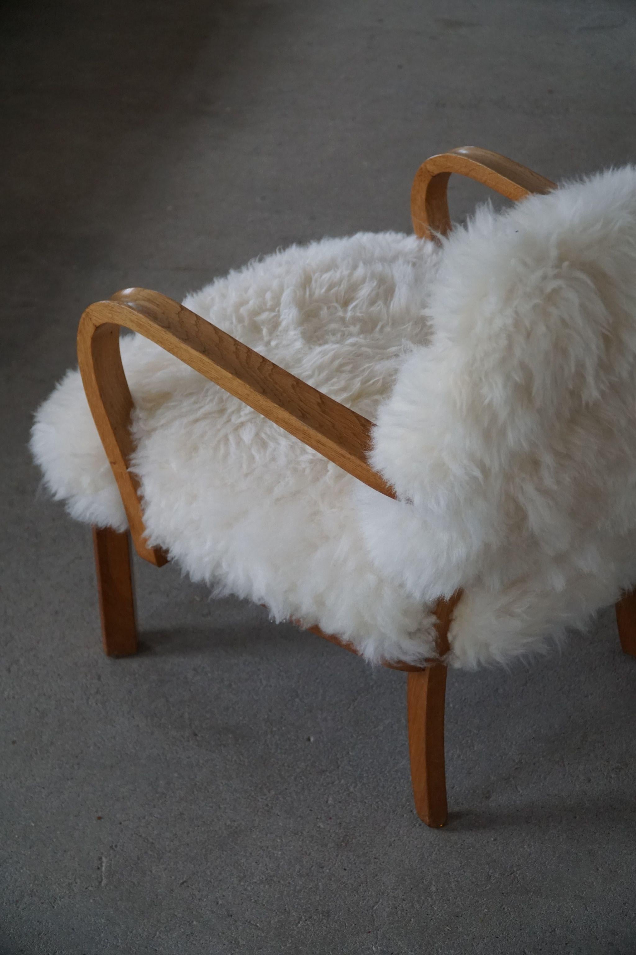 Mid-20th Century Danish Cabinetmaker, a Modern Pair of Lounge Chairs in Lambswool and Oak, 1950s