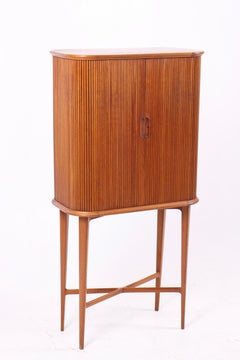 Danish cabinetmaker cabinet with cross stretcher. Front with tambour doors.