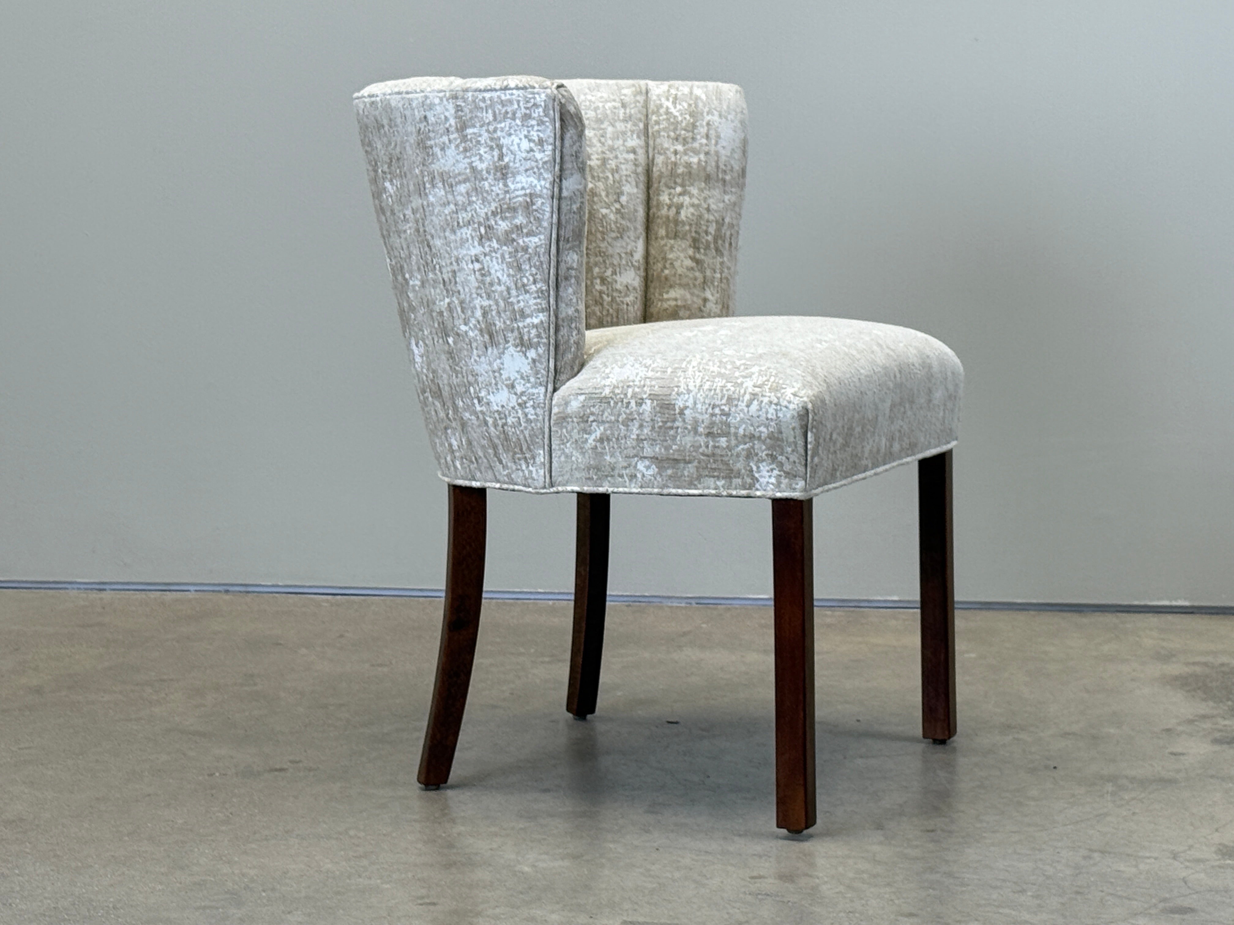 A beautifully restored Danish cabinetmaker desk chair with stained beech legs and new upholstery. 