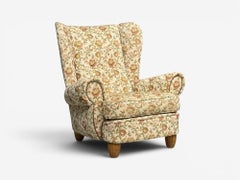 Ebanista danese, grande poltrona con schienale ad ali, tessuto a motivi floreali, legno, Danimarca, anni '50