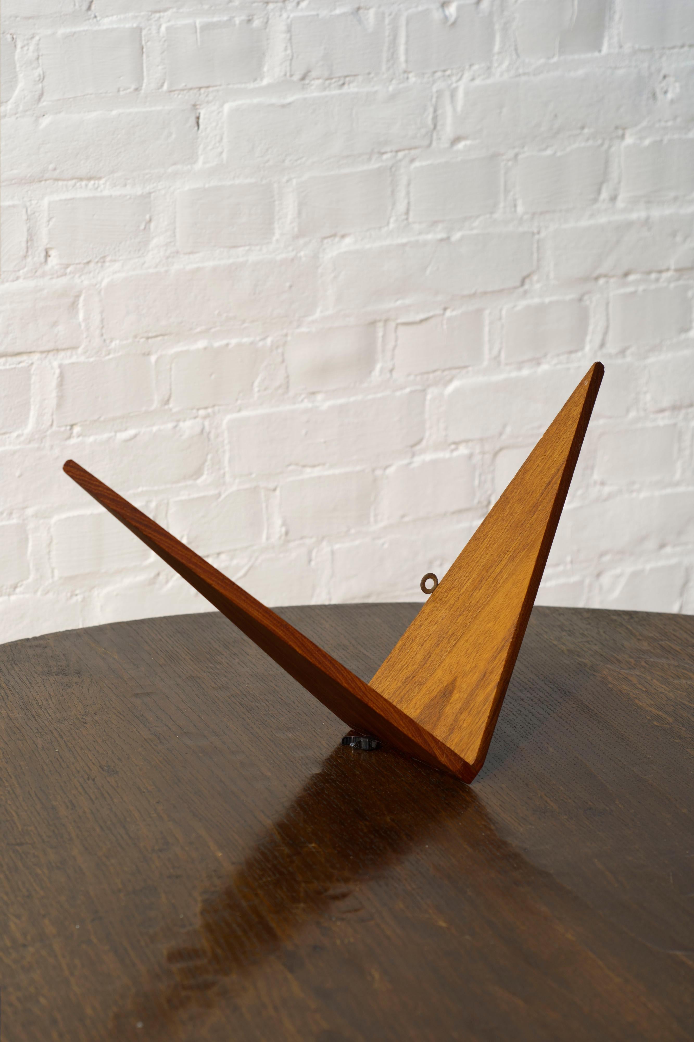 A unique handmade butterfly shelf made by a Danish cabinetmaker possibly inspired by the Poul Cadovius butterfly shelves. 

Unlike the original design this shelf features a dovetailed connection and is made from solid teak. 

Perfect as a small