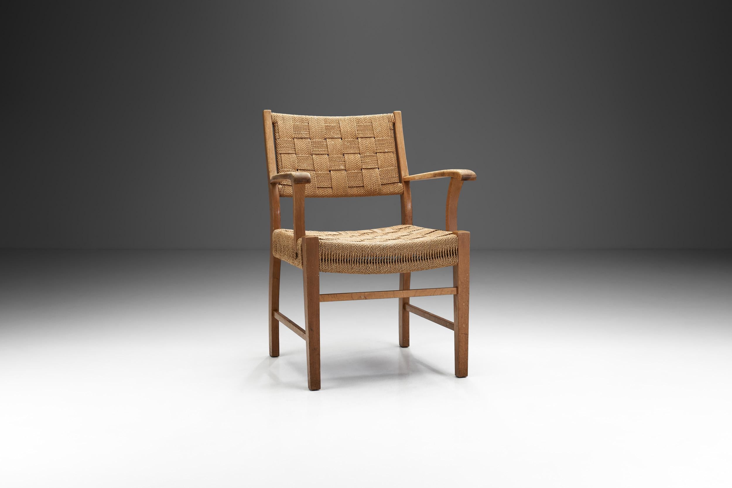Early Danish Modern cemented the Scandinavian design principles of quality, functionality, and an unadorned, understated look. Accordingly, this chair is defined by its materials, the finely worked oak and woven cord.

This classic armchair stands