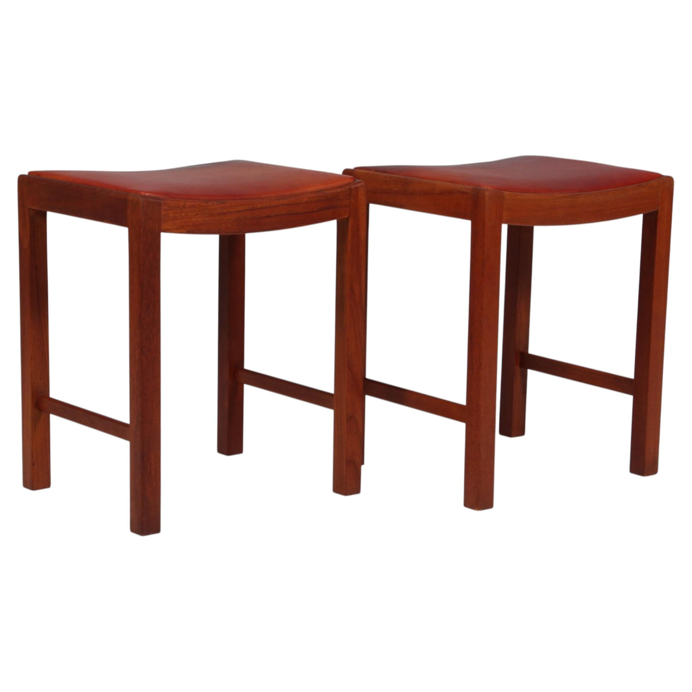 Danish Cabinetmaker pair of stools in mahogany and patinated Niger leather. 1940