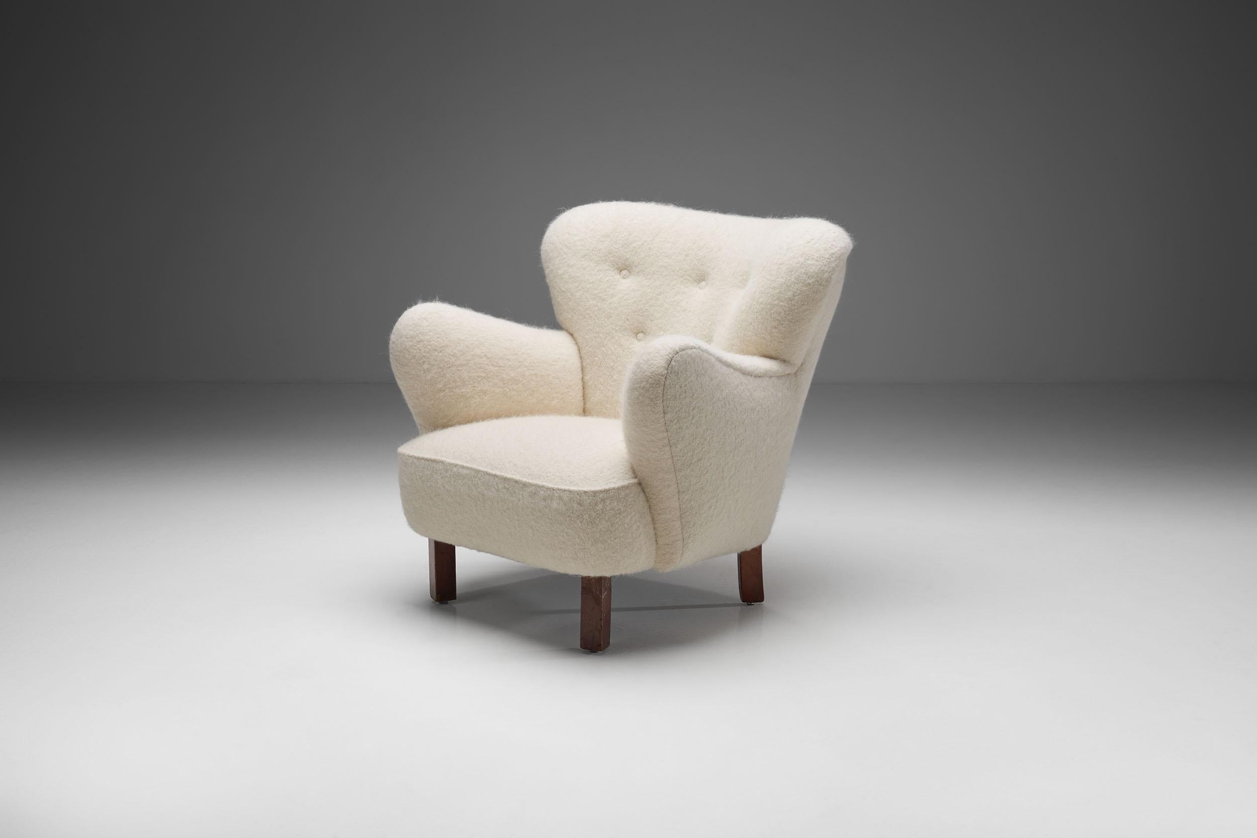 This unique 1940s “Polar” chair is a great representation of the quality and craftsmanship of Danish master cabinetmakers and the immediately recognizable characteristics of Scandinavian design.

The slender wooden legs prevent the chair from