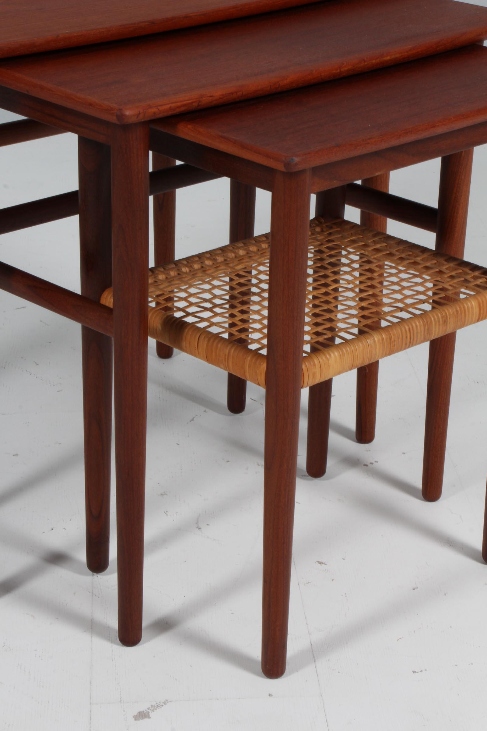 Scandinavian Modern Danish cabinetmaker set of nesting tables of teak with cane detail