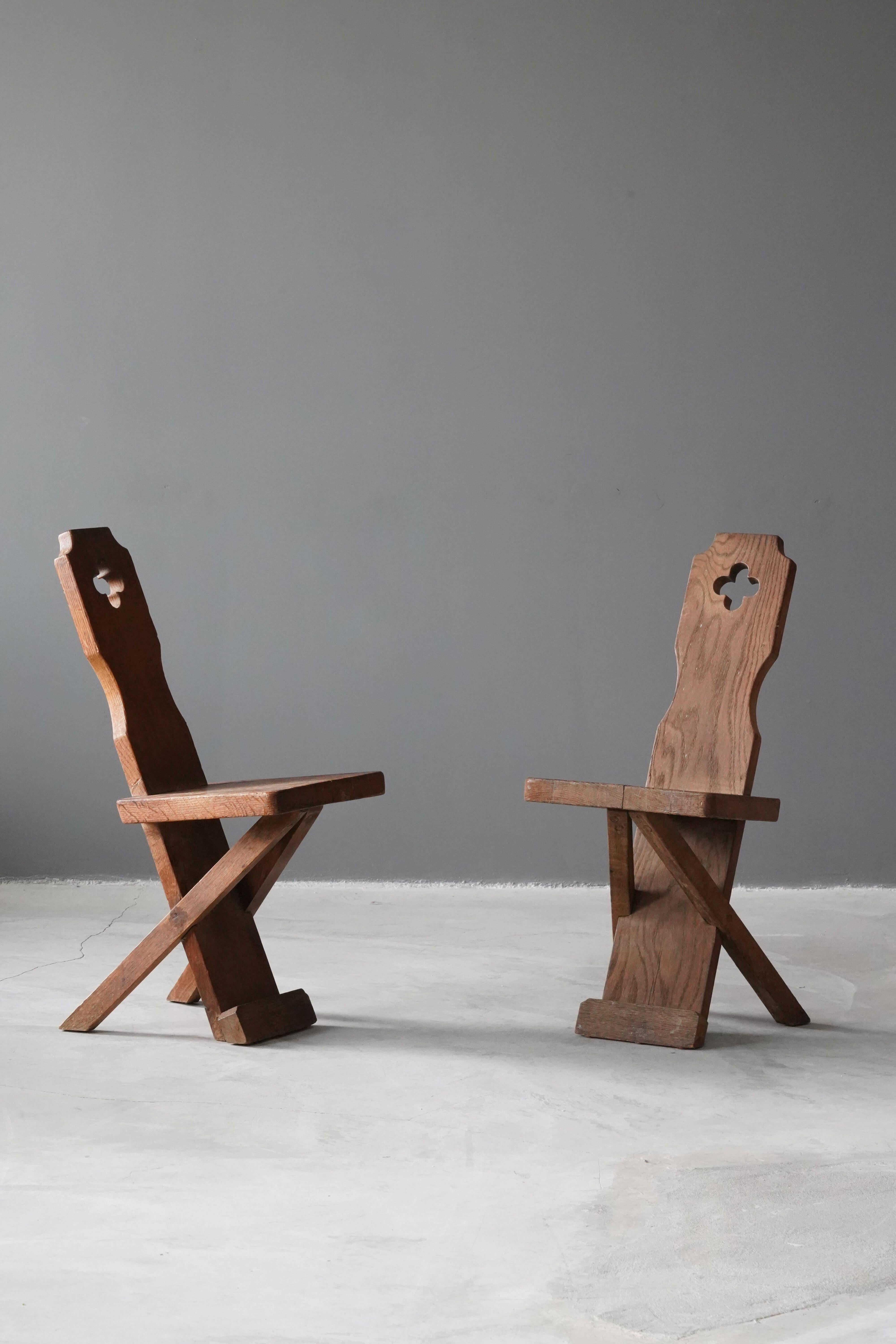 A pair of side chairs, designed and produced in Denmark, 1930s-1940s. In solid carved oak. 

Other designers of the period include Axel Einar Hjorth, Frank Lloyd Wright, Emile Jacques Ruhlmann, and Eliel Saarinen.