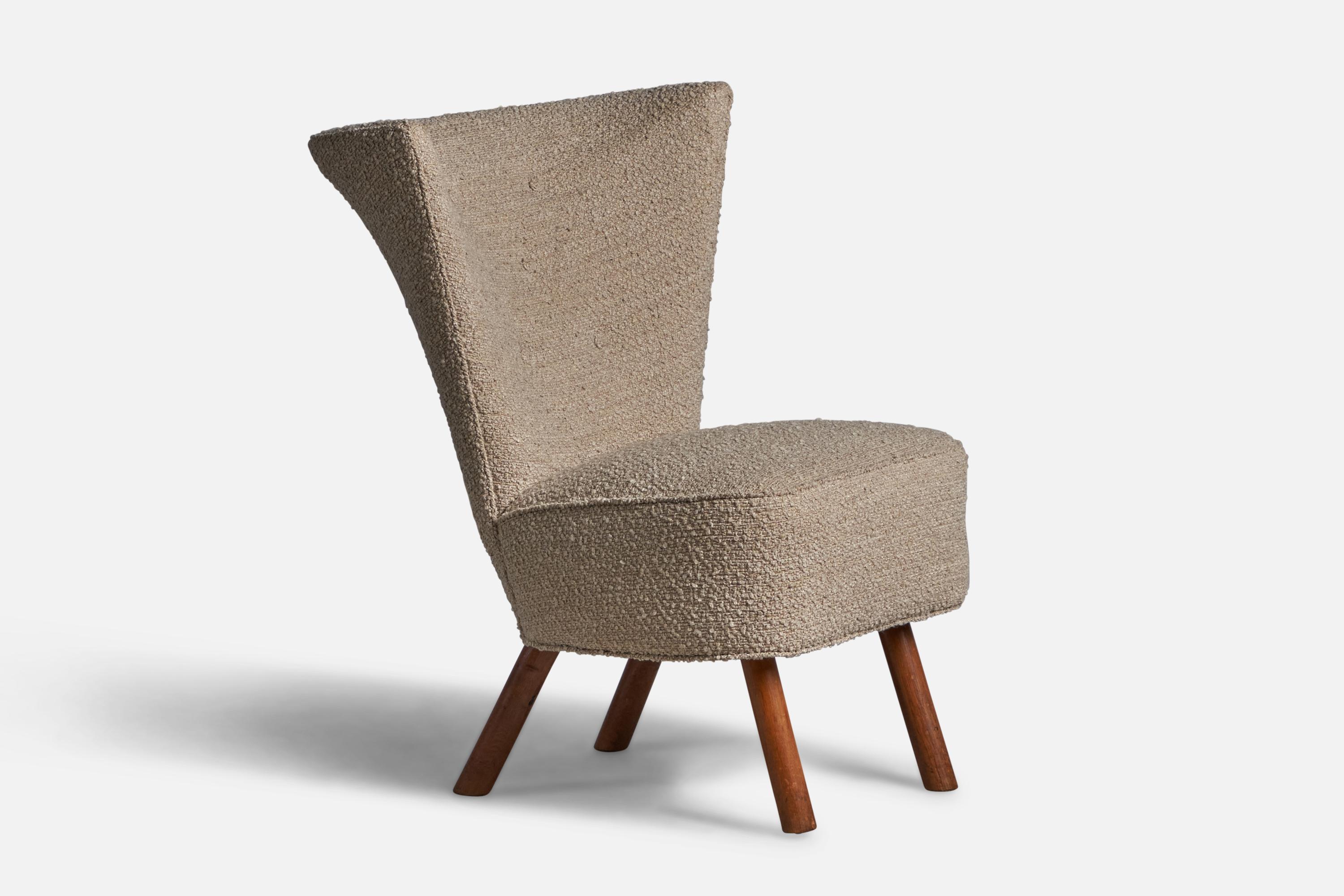A beige bouclé fabric and wood slipper lounge chair, designed and produced in Denmark, 1940s.

17.5” seat height