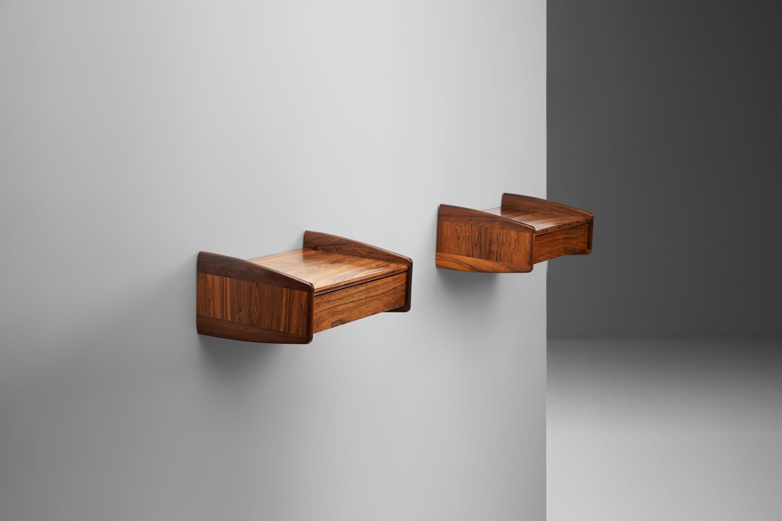 This pair of Danish mid-century wall mounted tables is very stylish in its elegance and outstanding wood material. Featuring smooth lines and solid wooden edges, these floating tables are of the highest quality.

Expert Danish cabinetry skills are