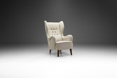 Danish Cabinetmaker Wing-Back Chair with Stained Beech Legs, Denmark 1940s