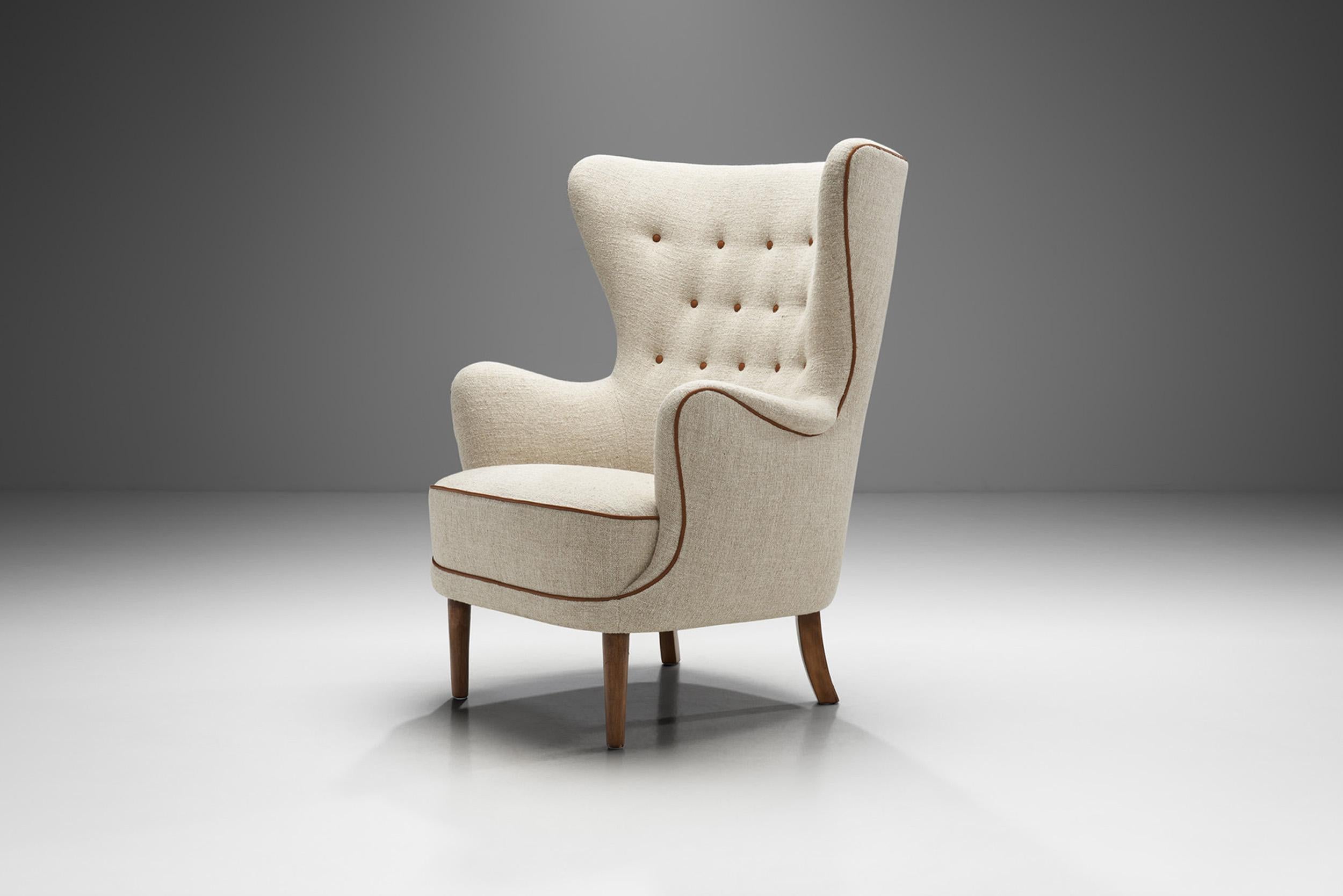 Simplicity, functionality, and elegance - these are the basic aspects of Danish design and accordingly, of this sophisticated wing-back chair. This unique model is a great representation of the quality and craftsmanship of Danish master