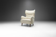 Danish Cabinetmaker Wingback Chair with Stained Beech Legs, Denmark, ca 1950s