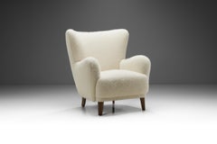 Danish Cabinetmaker Wingback Chair with Stained Wood Legs, Denmark, ca 1950s