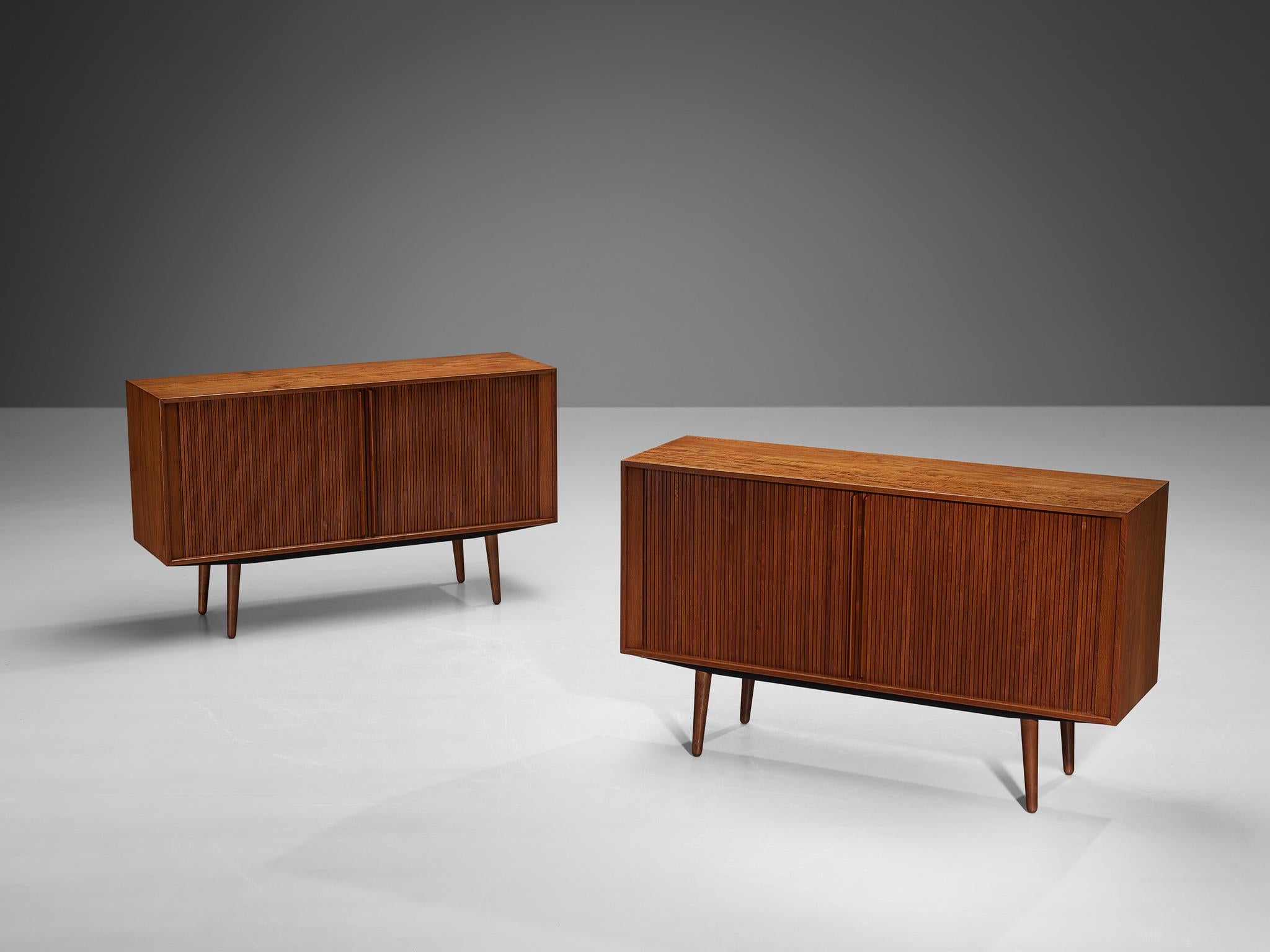 Cabinets, teak, birch, felt, Denmark, 1950s

This sideboard is exemplary for refined, highly detailed and very well-made furniture. The front corpus is furnished with tambour door panels that easily move sideways. The extended doorhandles and