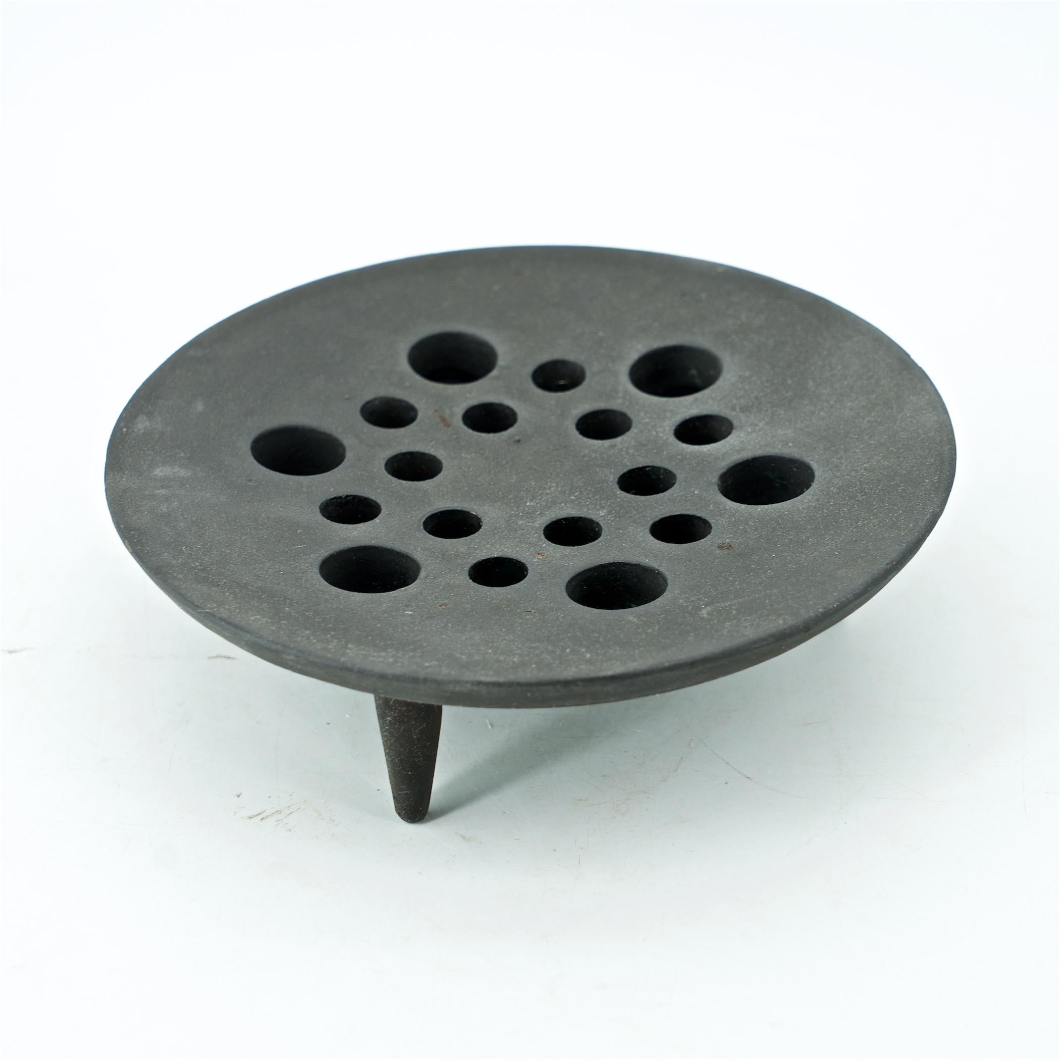 Uncommon form. Very matte grey/black, 2-piece, cast iron candelabra or dish with pierced lid. Heavy little table decor. Weighs just over 5.5 lbs.