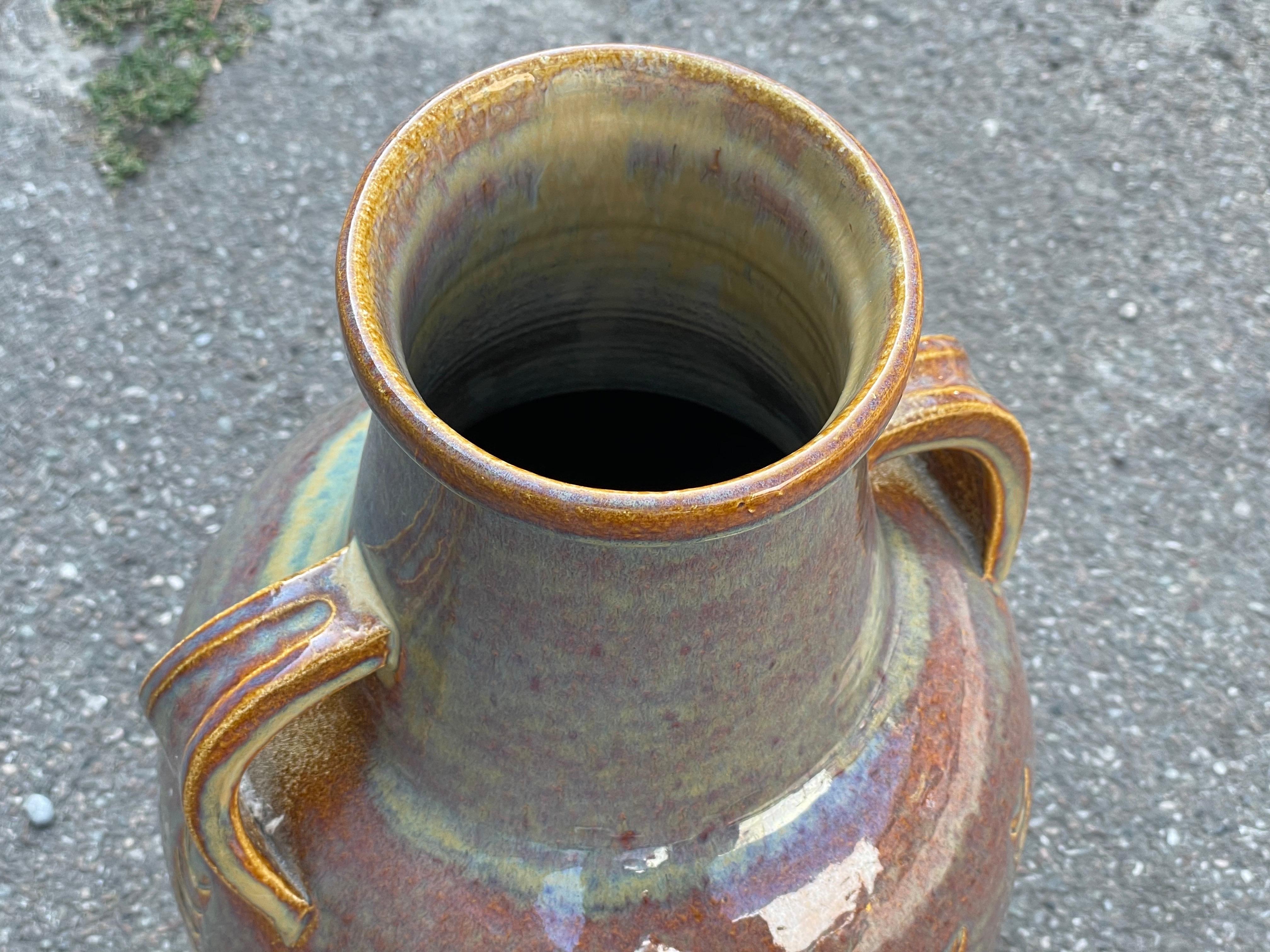 Bornholm is a famous Danish island in the Baltic sea. At this island you find some of the most interesting mid century modern ceramics art produced in Denmark. This floor vase is a perfect example and is in a super condition from the late 1960´s or