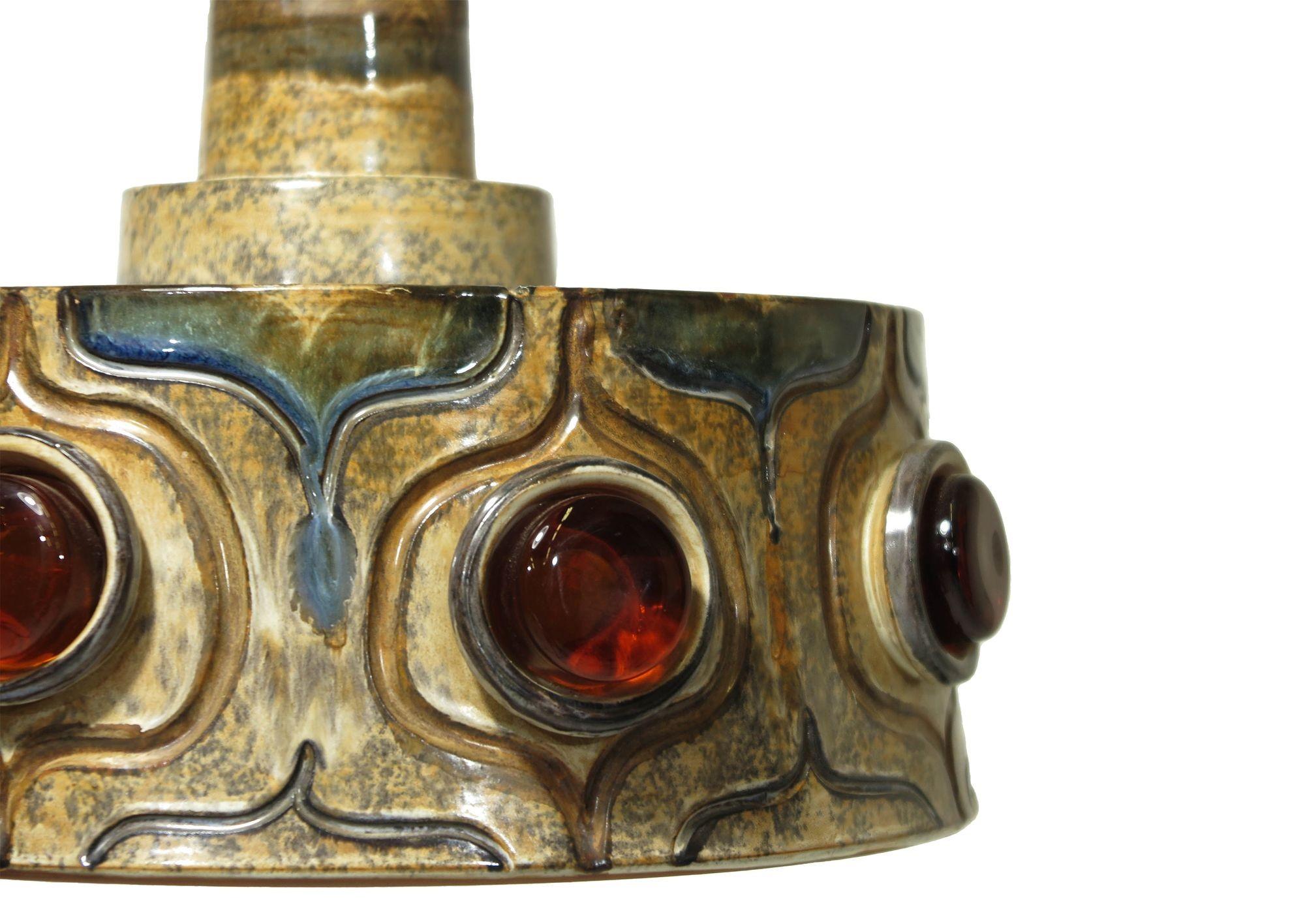 Danish pendent light by Jette Helleroe for Axella, features multi glazed ceramic with orange glass. Signed.
Measurements 13.75 x 8.75