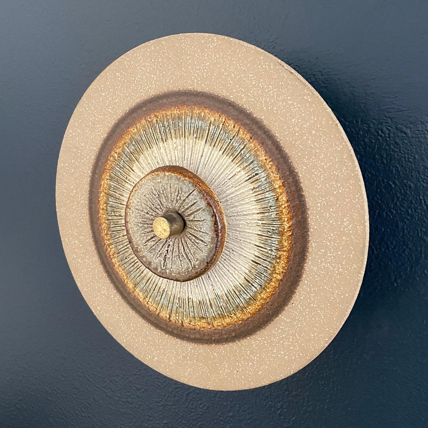 Danish ceramic sconce by Søholm Keramik
Designed by Noomi Backhausen 
Denmark, circa 1960s
Dual layered neutral tone stoneware discs
Newly rewired.