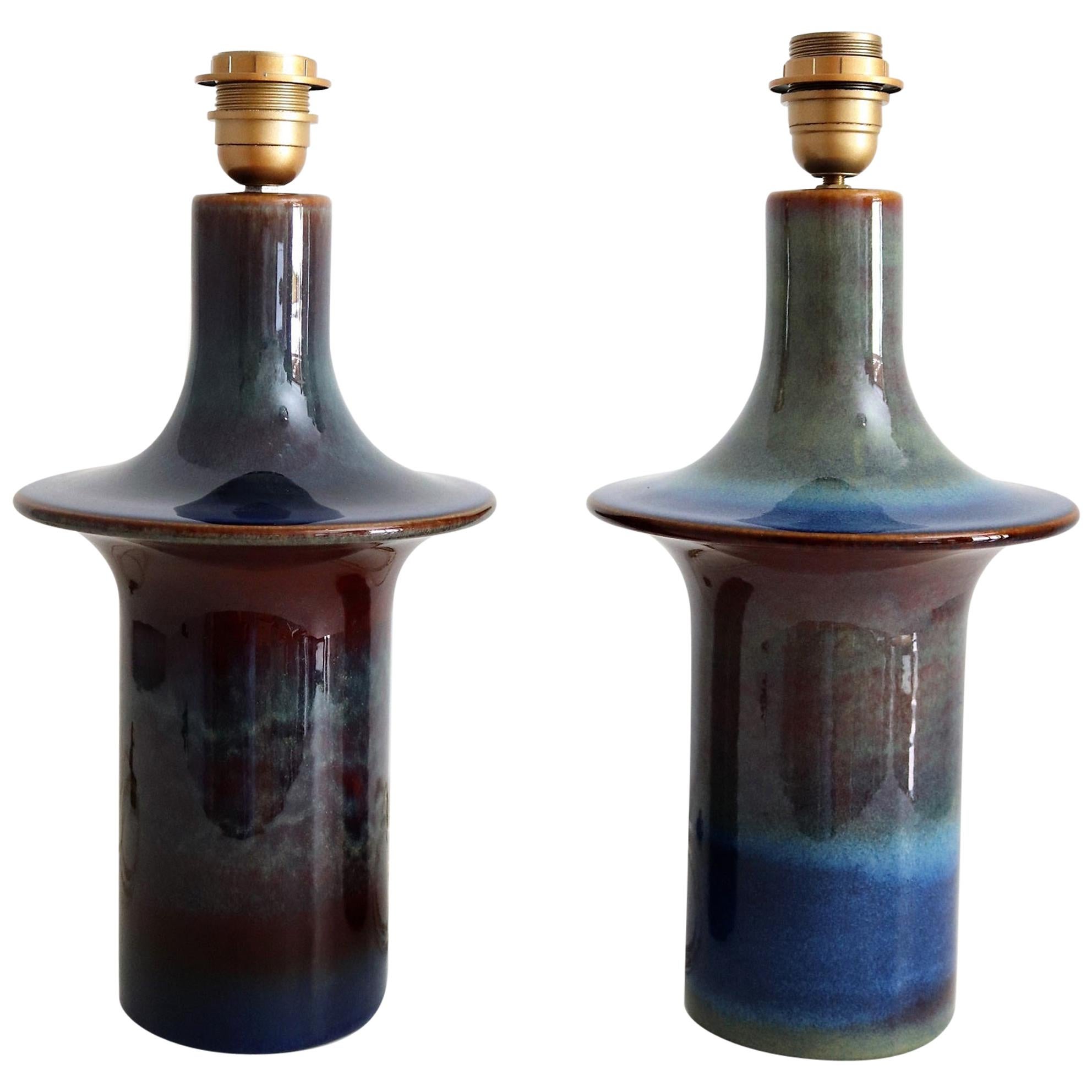 Beautiful pair of table lamps with gorgeous shiny multicolor glaze in mint refurbished condition.
The lamps have been made from Søholm Stentøj, Denmark and are both marked. One is little taller than the other.
Electrics as wires and bulb holders