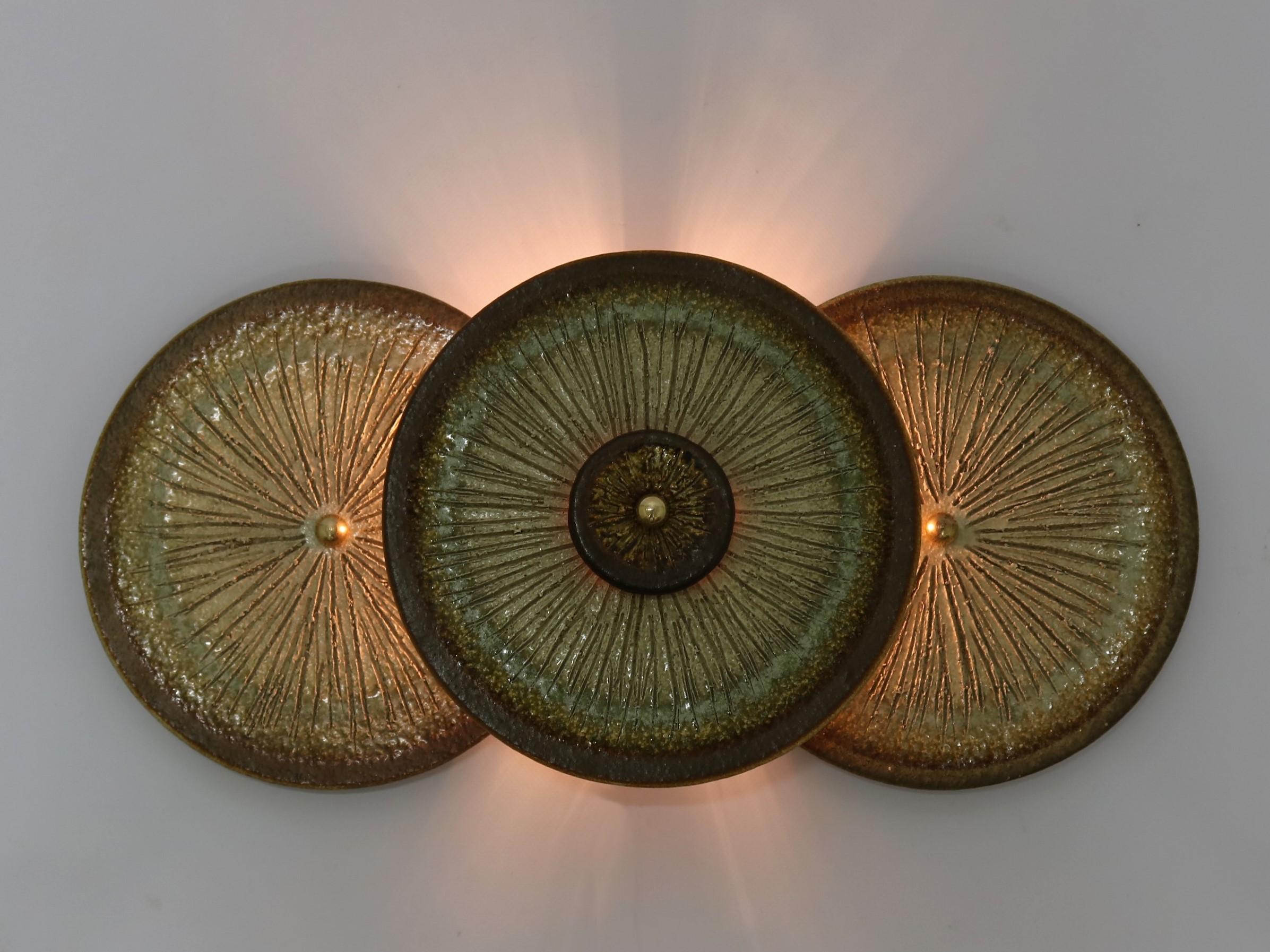 A stunning wall light or decoration by Noomi Backhausen and Poul Brandborg for Soholm/Denmark, circa 1960. The wall lamp is made from glazed stoneware in the typical style of 1960s Danish ceramics. Equally beautiful in daylight or lit at evening.