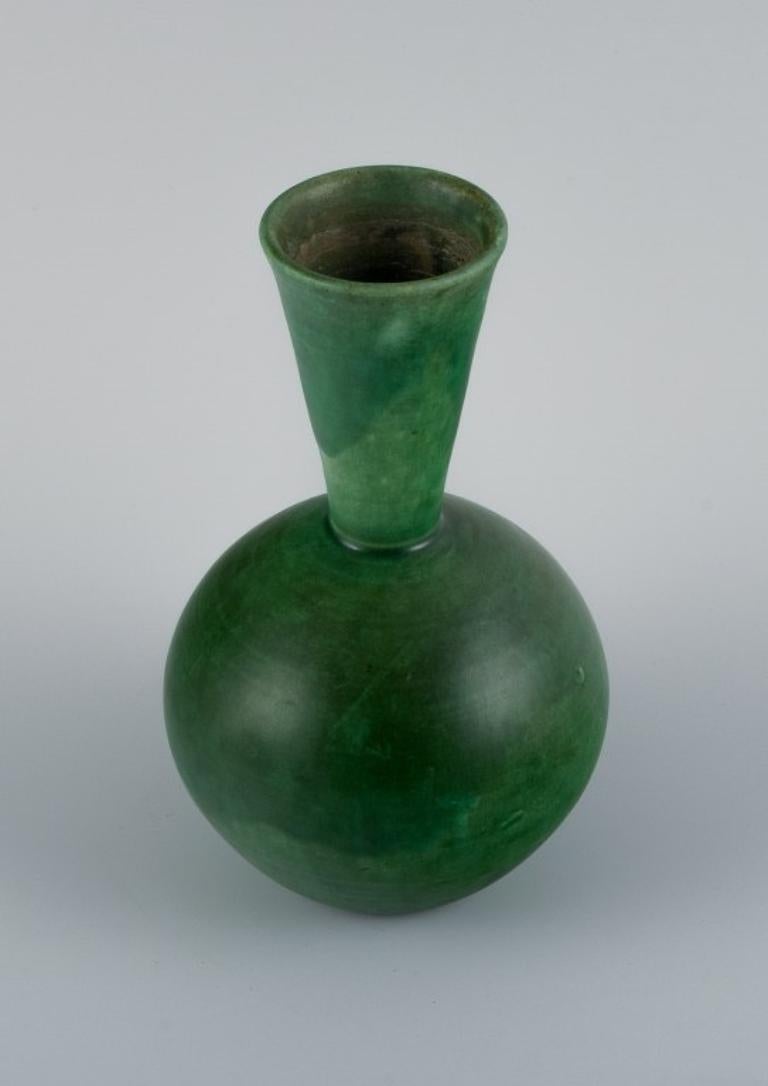 Scandinavian Modern Danish ceramicist. Ceramic vase with glaze in green tones. Mid-20th century. For Sale
