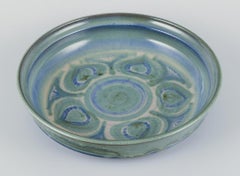 Danish ceramicist. Large ceramic bowl. Glaze in blue and green tones.