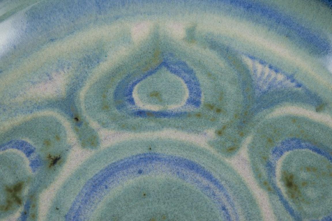 Danish ceramicist. Large ceramic bowl. Glaze in blue and green tones. In Excellent Condition For Sale In Copenhagen, DK