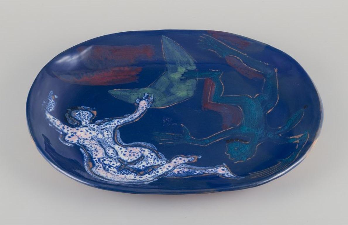 Scandinavian Modern Danish ceramicist. Unique ceramic dish. Motif of a floating couple. For Sale