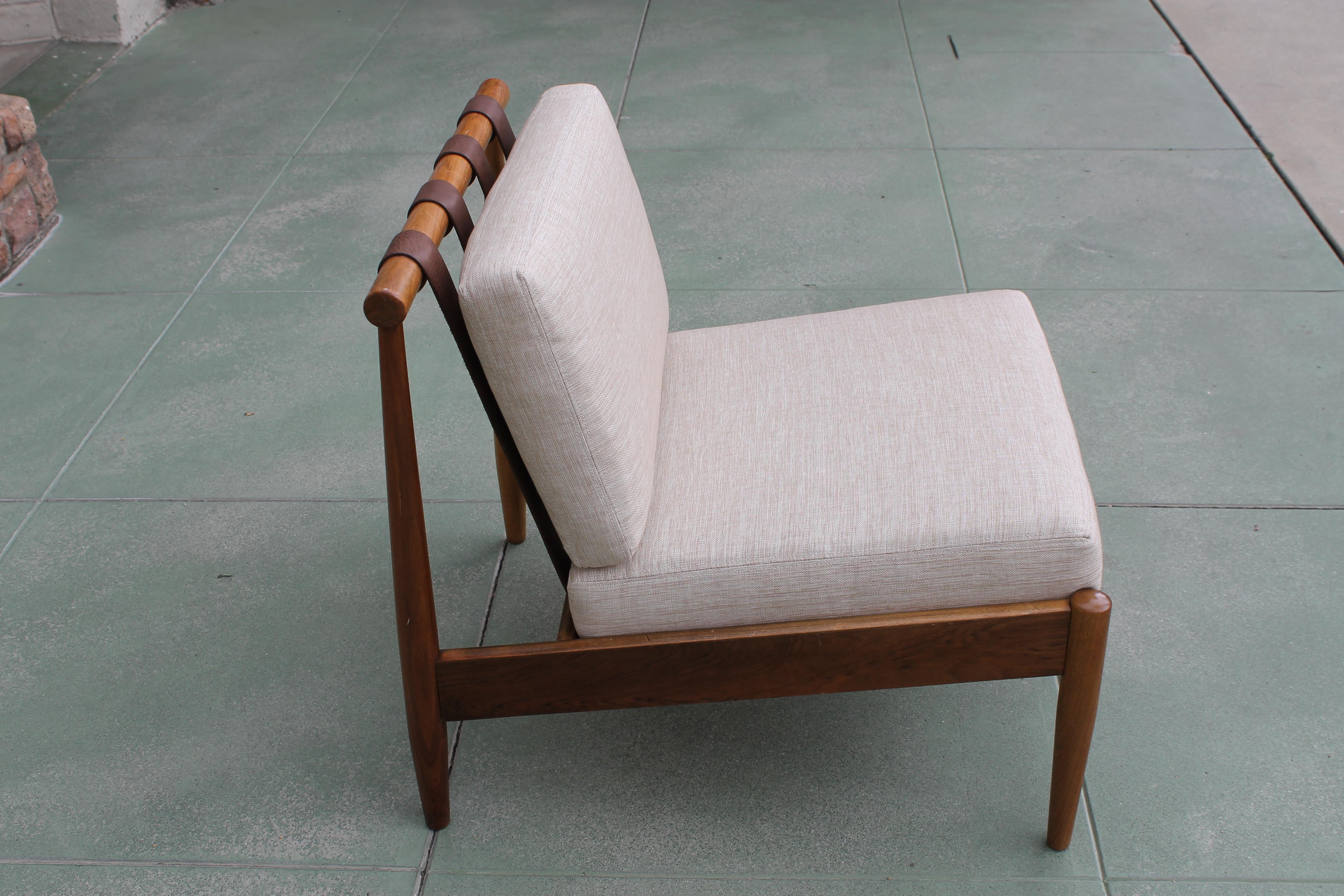 Lounge chair designed by Hans C. Andersen, Denmark. We put new webbing on seat, leather straps and new cushions. Chair measures: 25