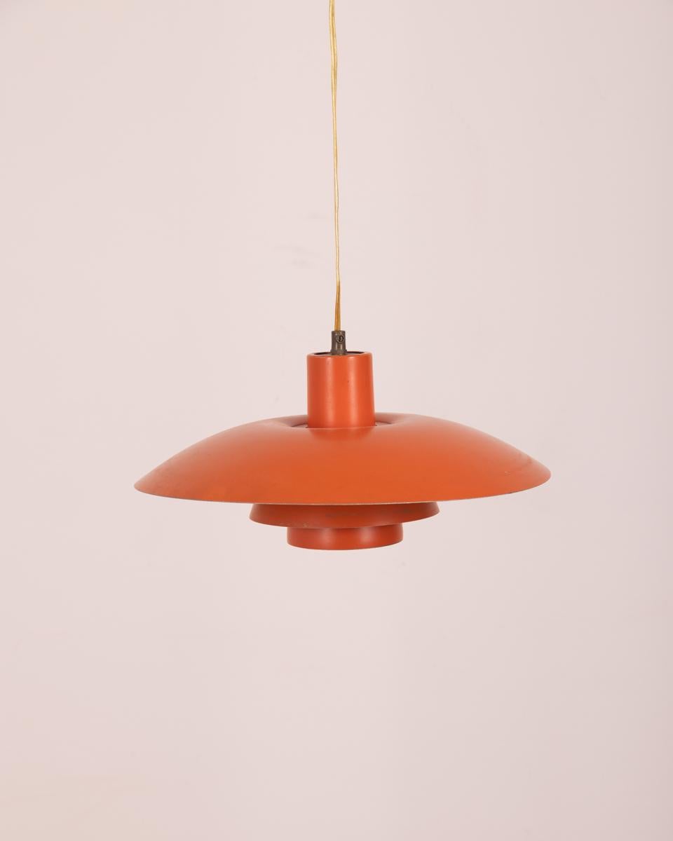 Orange metal chandelier, model 4/3. Design Poul Hanningsen for Louis Poulsen, 1960s.

Condition: In good condition, functional, it shows signs of wear caused by time.

Dimensions: Height 19 cm; Diameter 42cm

Materials: Metal

Year of