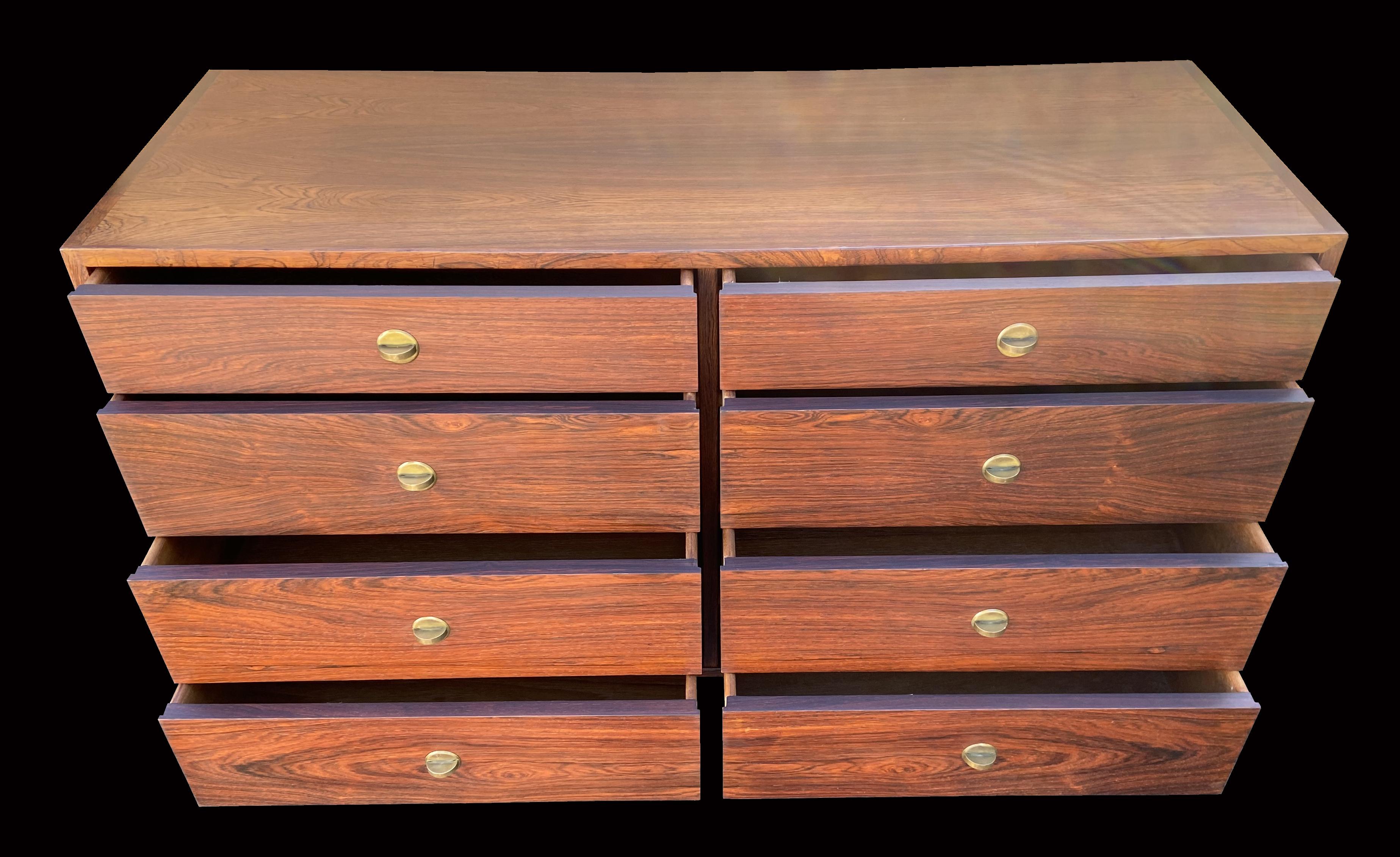 A very useful stylish chest, 8 quite large drawers, each with a single little brass knob handle, and all in very nice original condition.
This item is made from Santos Rosewood or Pau Ferro, latin name Machaerium Scleroxylon, and is not included on