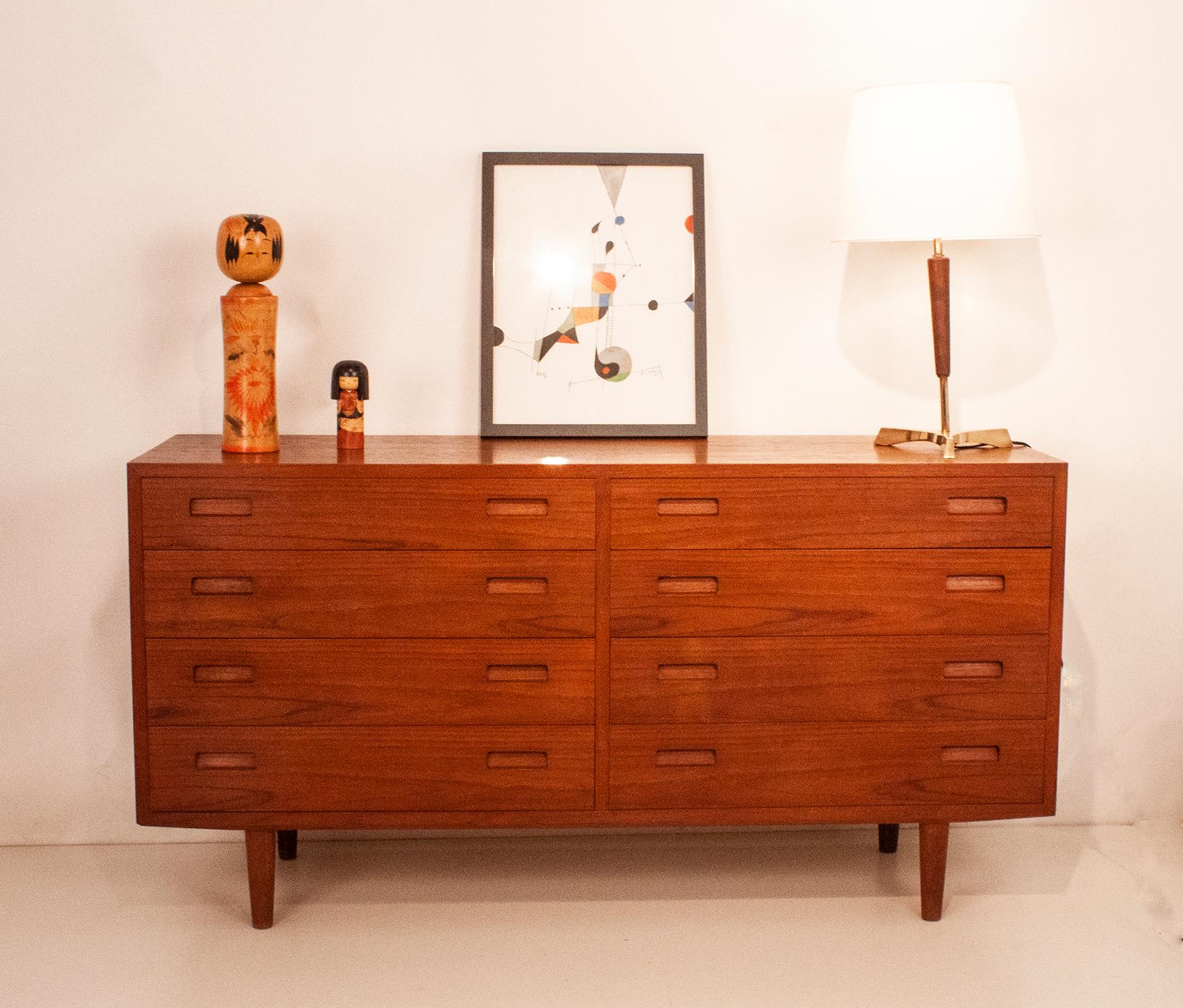 Midcentury chest of drawers designed by Carlo Jensen for Hundevad & Co. It was produced in Denmark during the 1960s. 
Nice proportions and good construction.