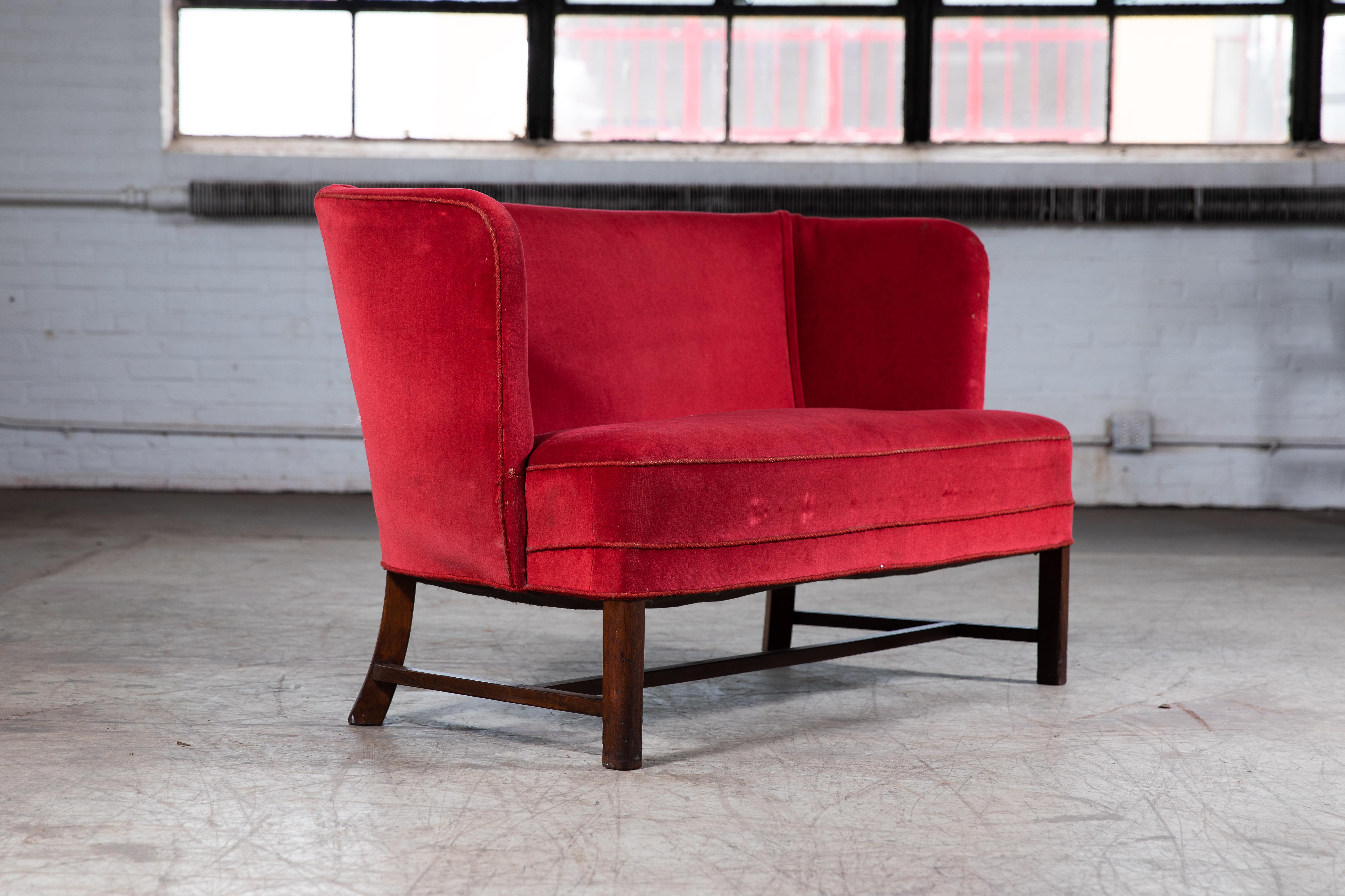 Classic, rare and very elegant Danish 1930s bench or settee in the style of Kaare Klint and Frits Henningsen. The settee is unmarked as was most often the case at the time it was produced, however, it shows many design cues reminiscent of Klint and
