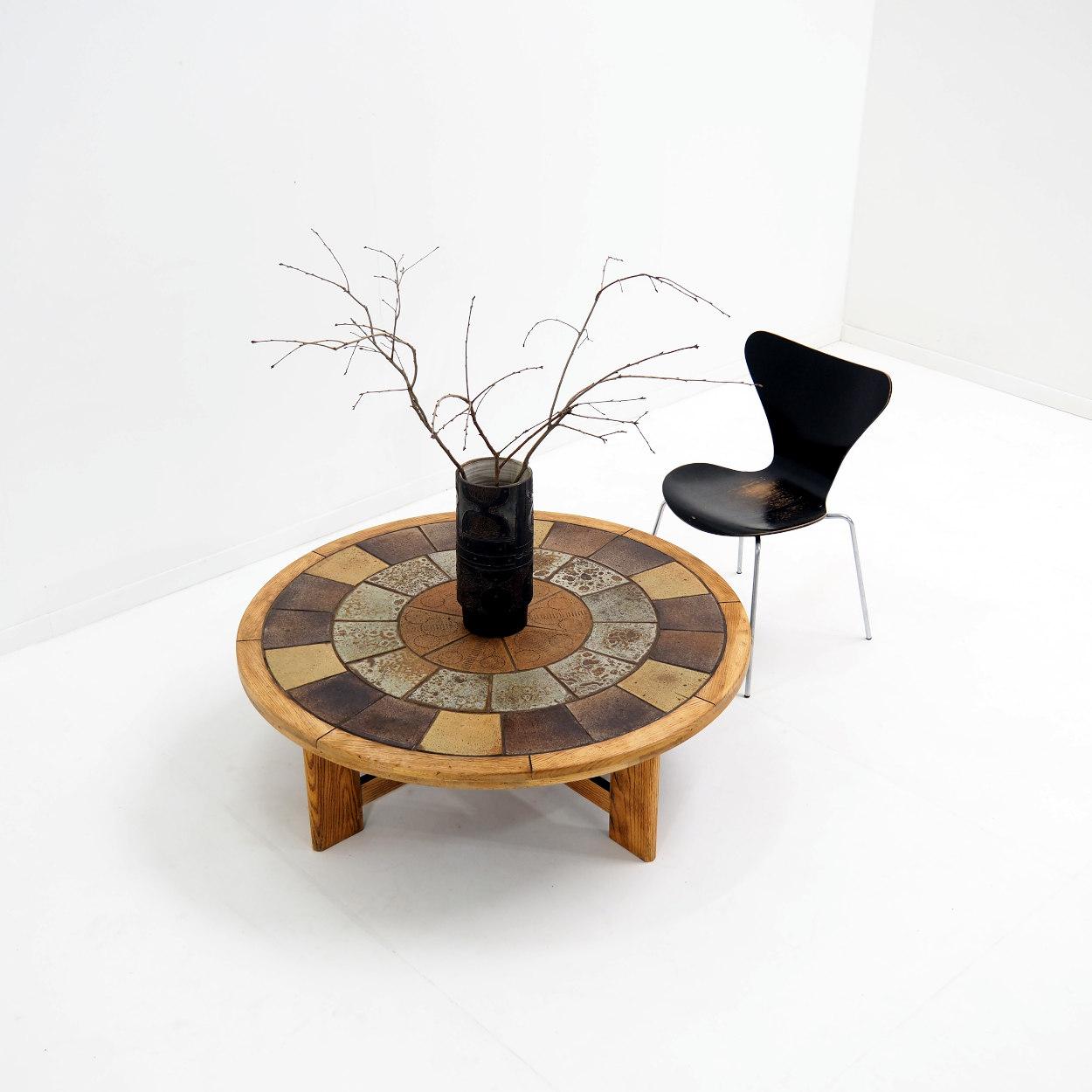 Very solid coffee table with a strong and basic architecture. The table is designed by the Danish artist designer Tue Poulsen for Haslev Mobelsnedkeri, a Danish manufacturer.

The table was made in the 1960s with handmade ceramic tiles and a solid