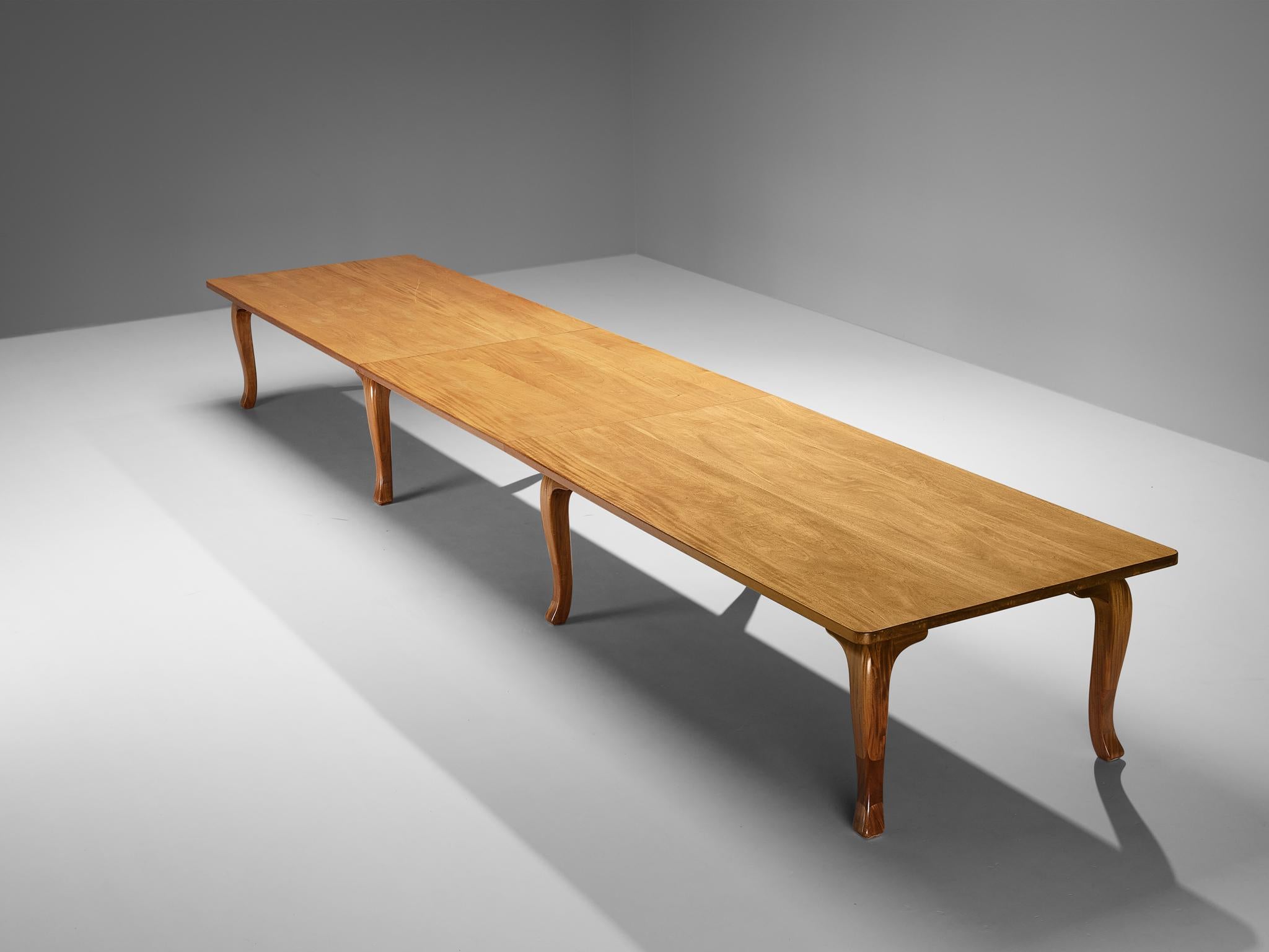 Dining or conference table, stained mahogany, pine underside, Denmark, 1960s

This grandiose table of Danish origin features a tripartite structure defined by clear lines and fine materials. The rectangular-shaped top is held by six elegantly