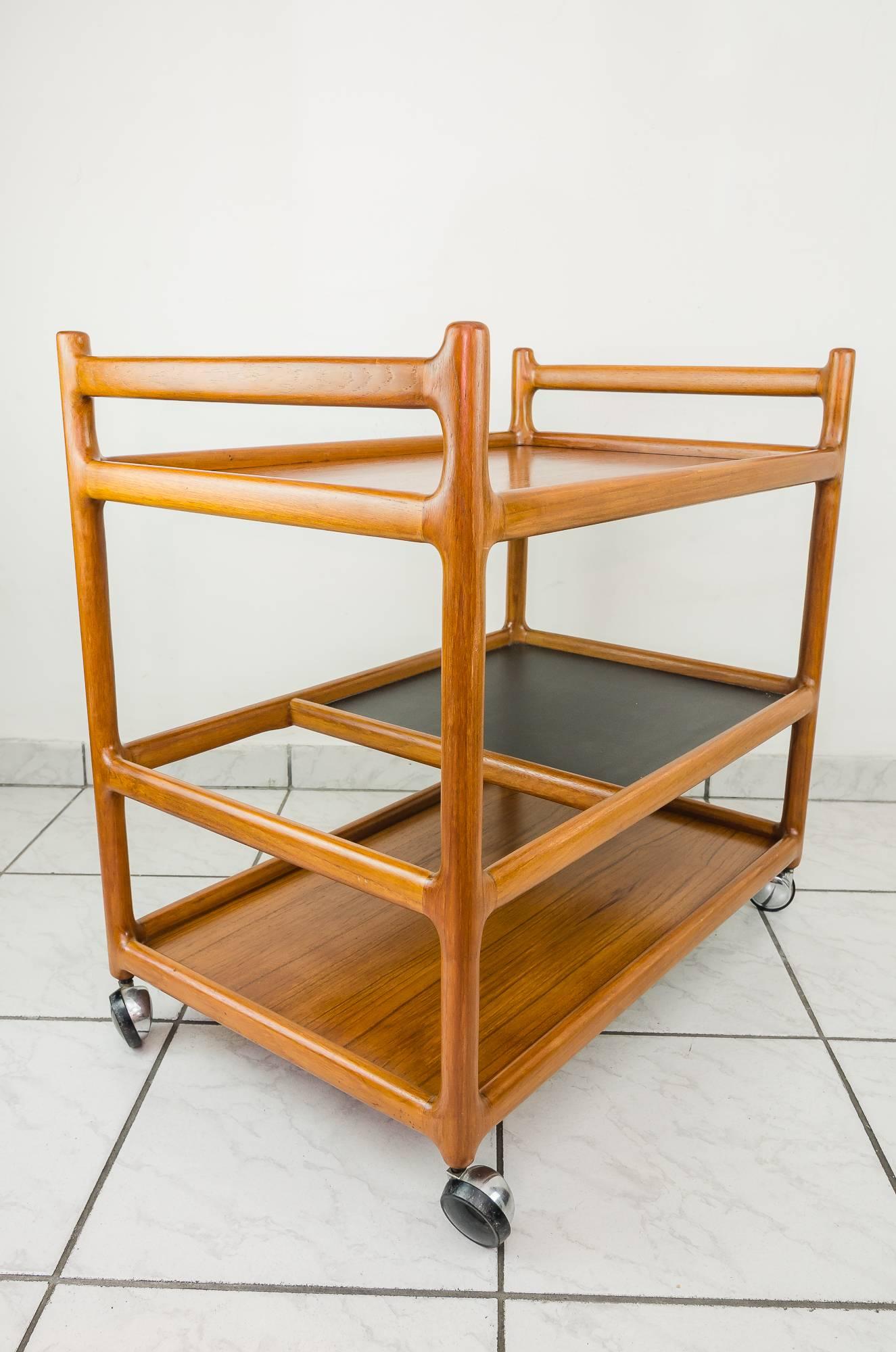 Danish control serving cart, 1960s
Teak trolley designed by Johannes Andersen.
Produced by CFC Silkeborg Møbelfabrik in Denmark.
Original condition.
 