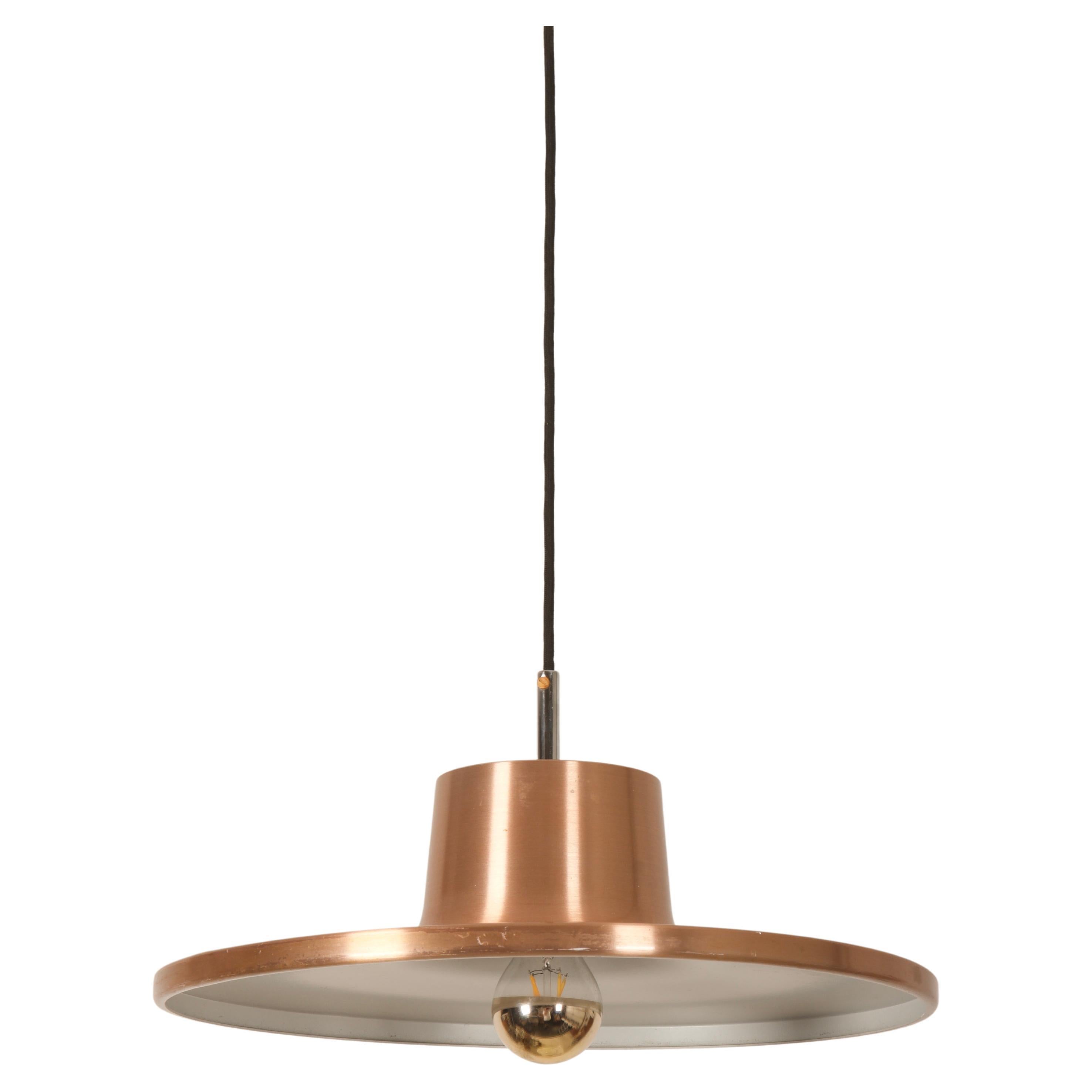 Aluminum shade copper plated fitted with one W27 socket. Made in Denmark in the 1970s.