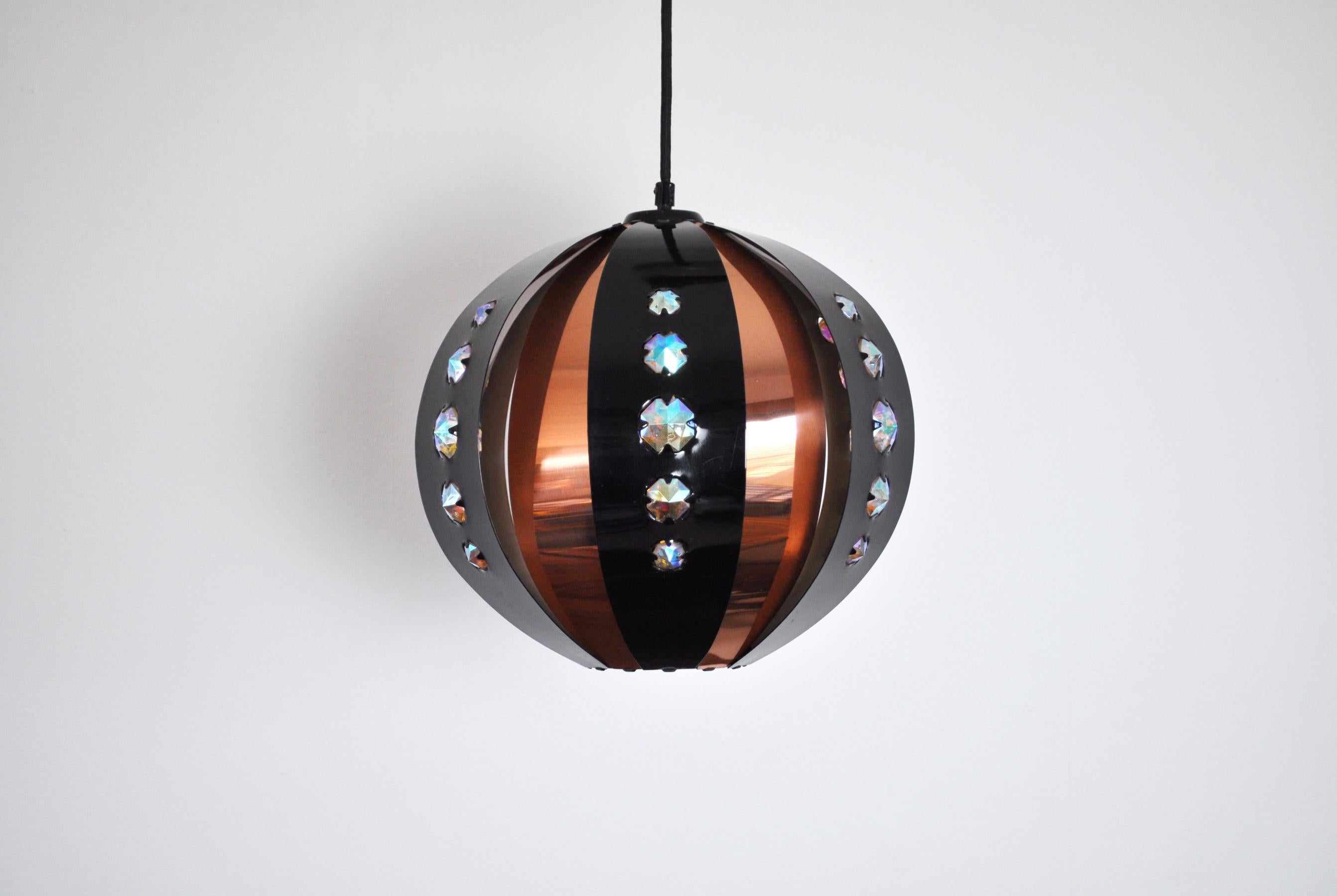 Coronell of Denmark pendant designed by Werner Schou.

Black and copper metal stripes with faceted glass 