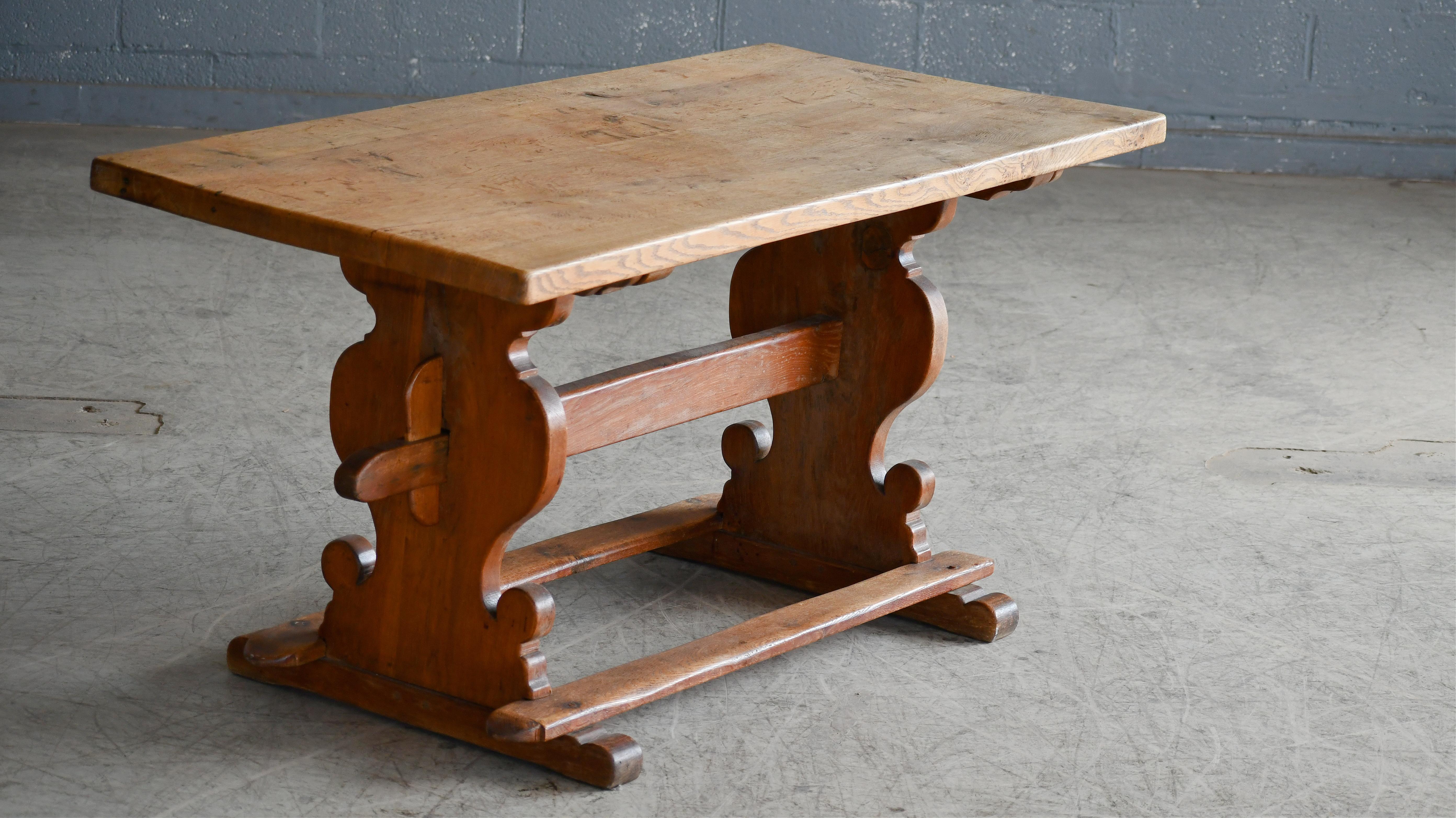 Great dining table in solid oak made in Denmark probably around 1900's. These style tables were common from about 1880 and found popularity again in the 1960's and 70's promoted by Designers as Henning Kjaernulff. This is an earlier version which