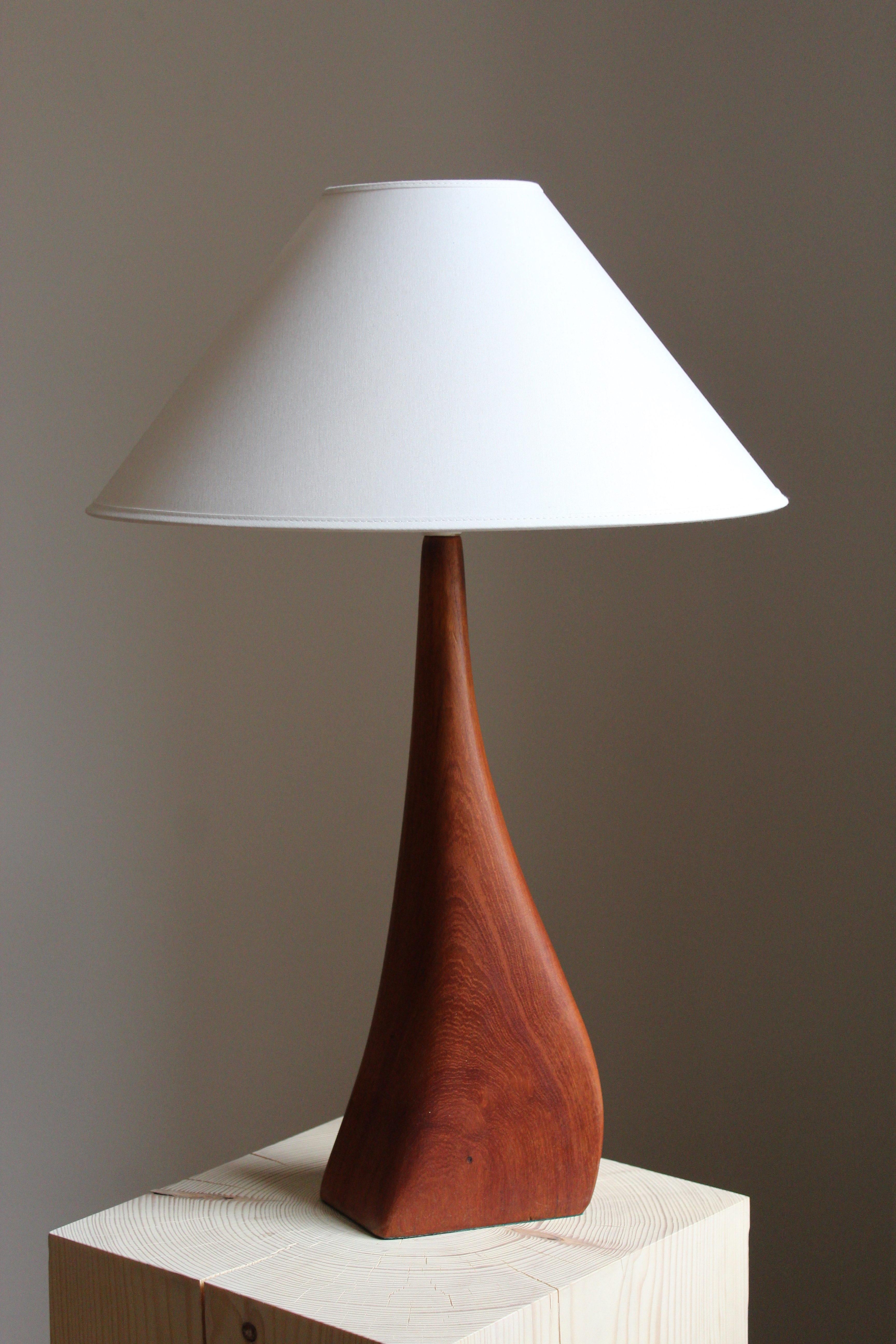 A finely sculpted teak table lamp. Produced in Denmark, 1960s. 

Sold without lampshade. Dimensions without lampshades.

Other designers of the period include Hans Agne Jacobsen, Josef Frank, Palshus, Kaare Klint, and Hans Bergström.