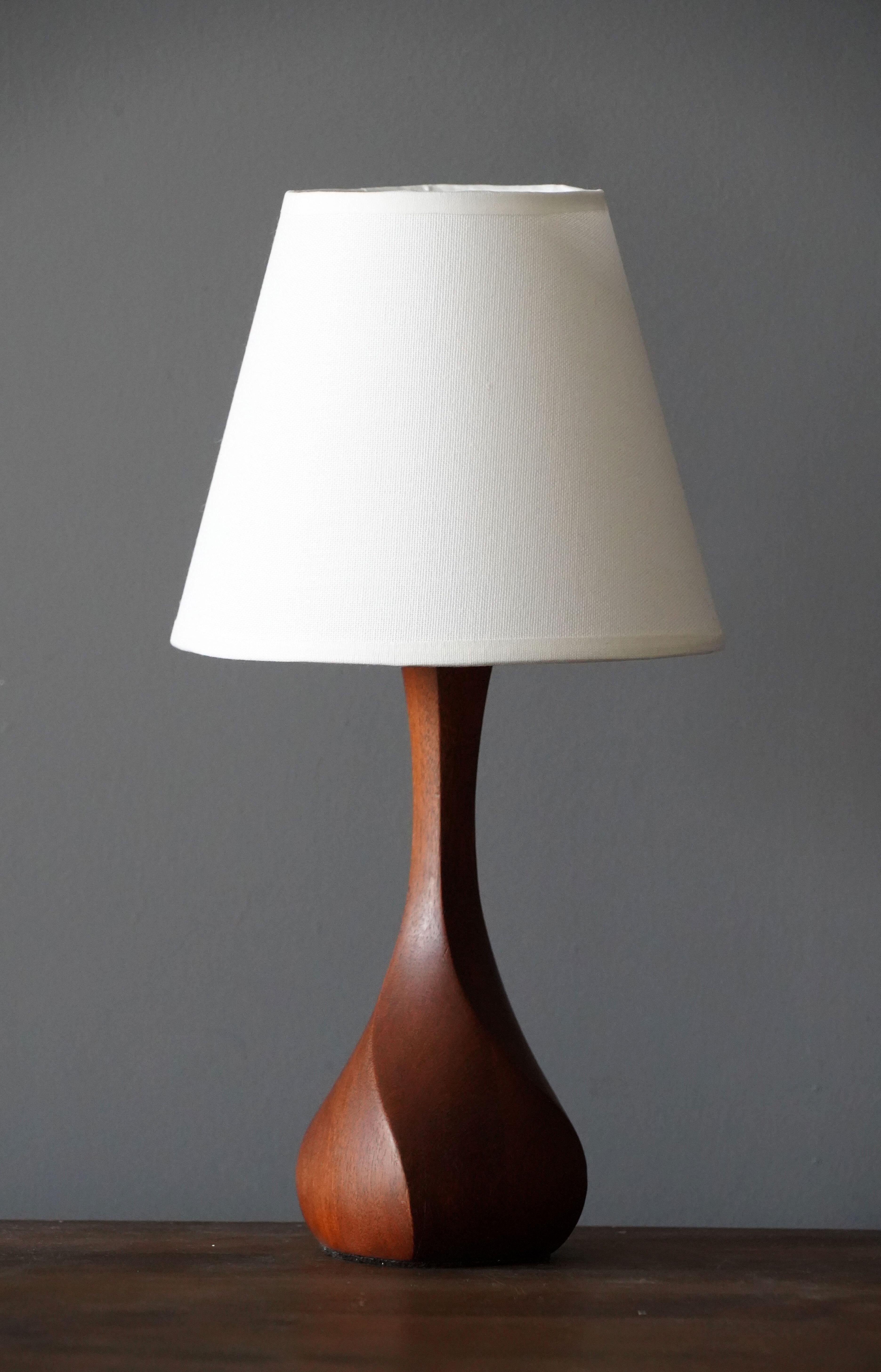 A finely sculpted teak table lamp. Produced in Denmark, 1960s. 

Sold without lampshade. Dimensions without lampshades.

Other designers of the period include Hans Agne Jacobsen, Josef Frank, Palshus, Kaare Klint, and Hans Bergström.