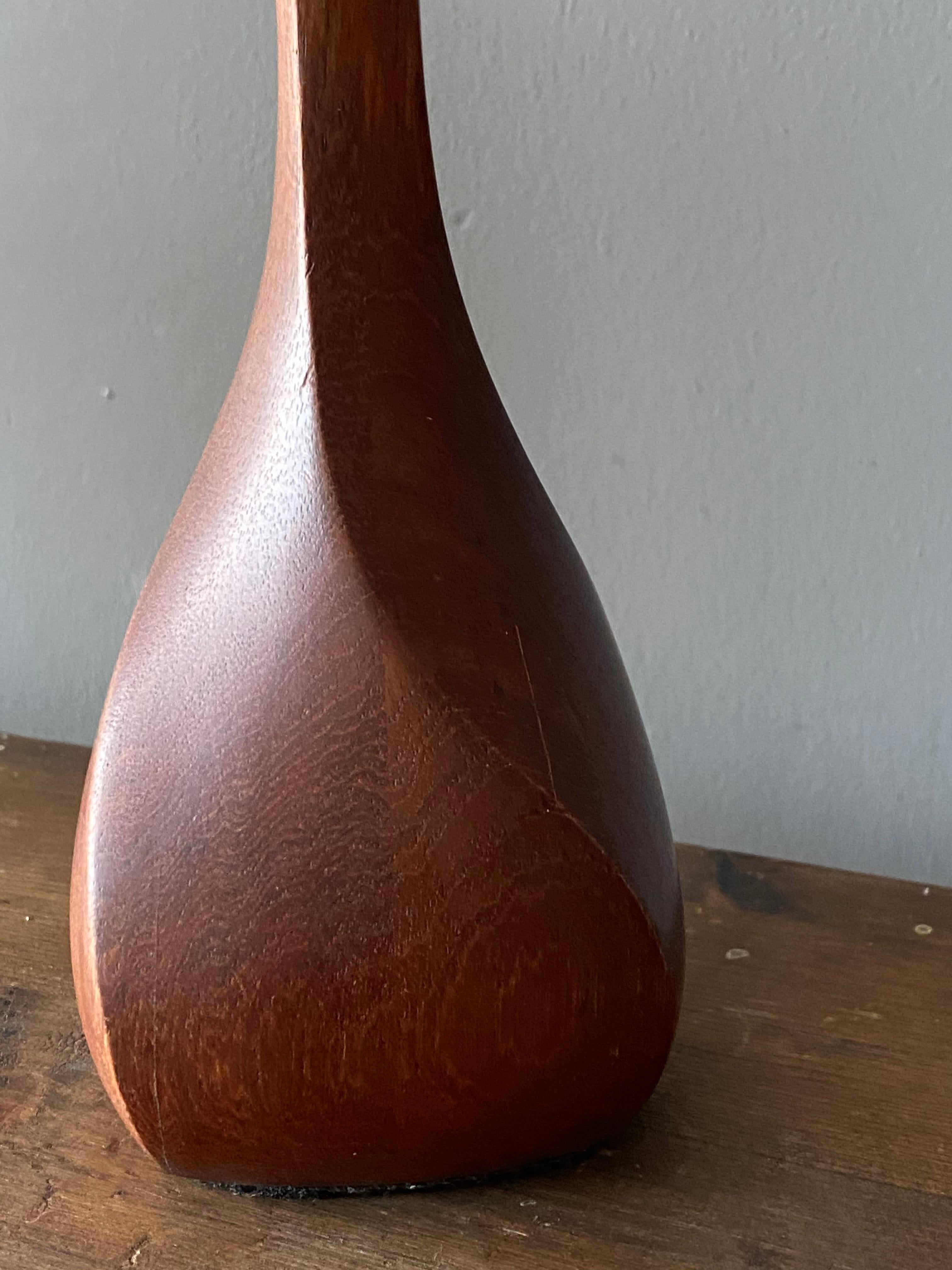 Mid-20th Century Danish Craft, Small Modernist Table Lamp, Sculpted Solid Teak, Denmark, 1960s