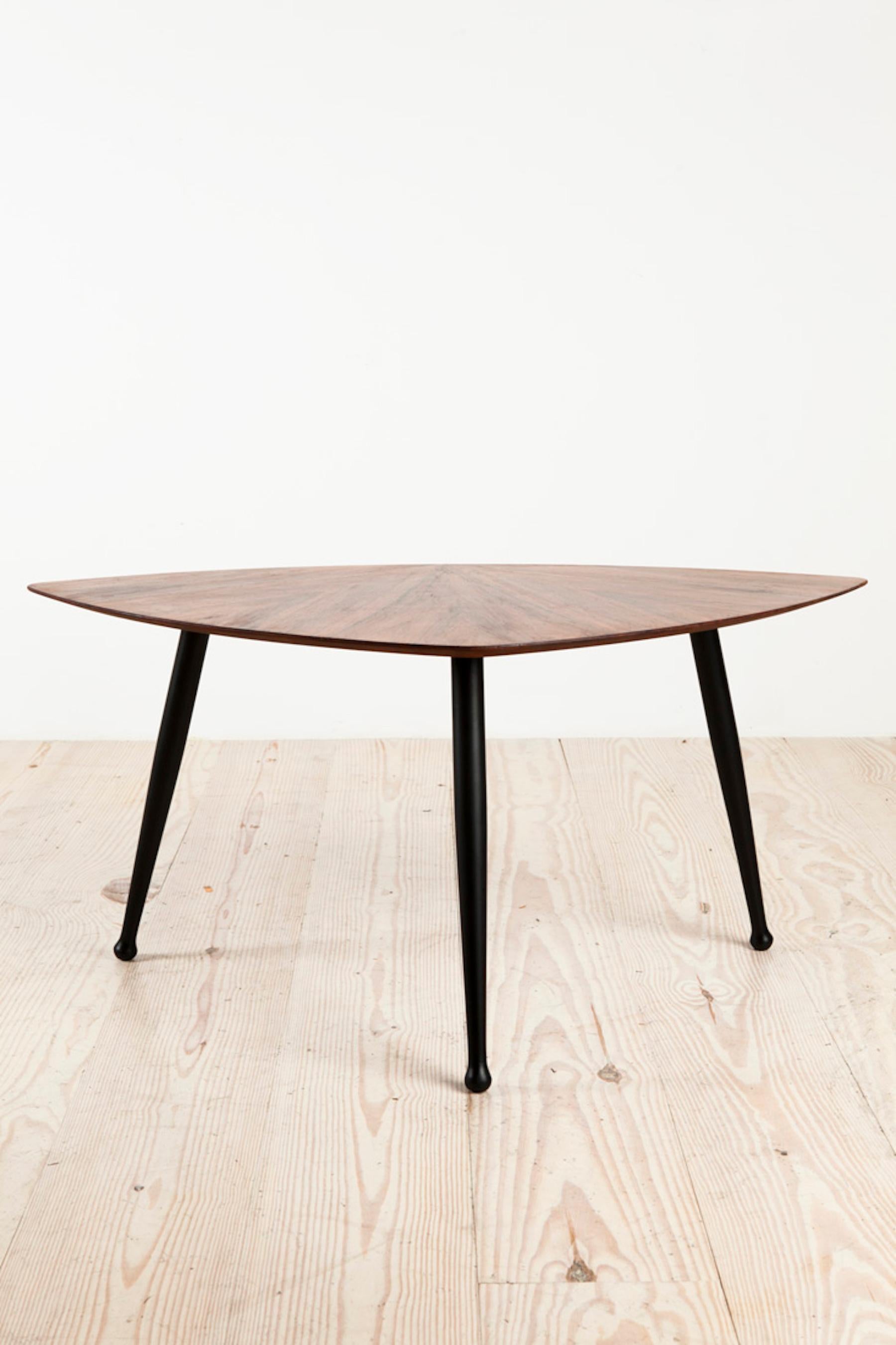 Danish midcentury Craftsman tripod base coffee table, rosewood veneer top with ebonized legs, origin: Denmark, circa 1960.