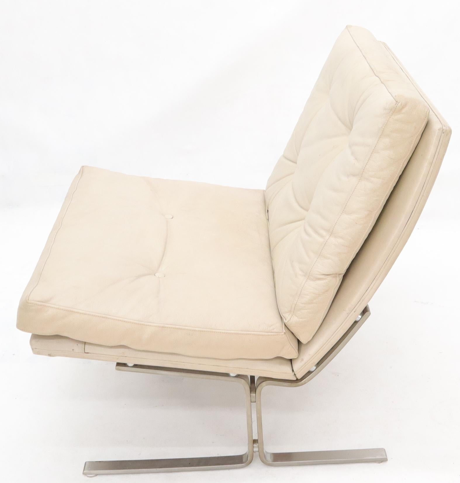 Danish Mid-Century Modern off-white leather scoop shape lounge chair on brushed chrome base. Made in Denmark by Centrum Mobler.