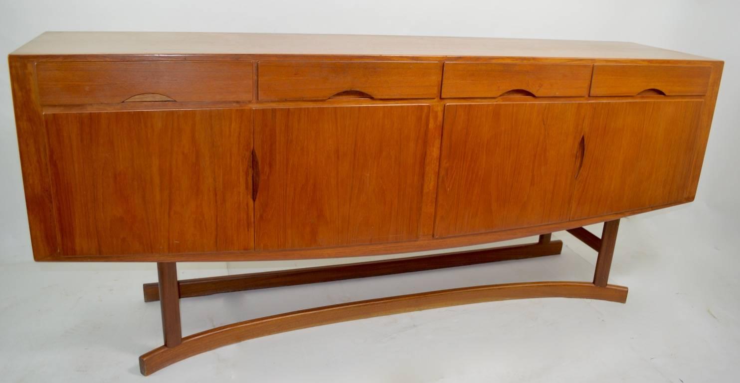 Rare Danish modern sideboard designed by Johannes Andersen, cabinetry by Hans Boch. Hard to find form, executed by recognized masters, selling in original, estate condition. This example shows some light cosmetic wear to finish, normal and