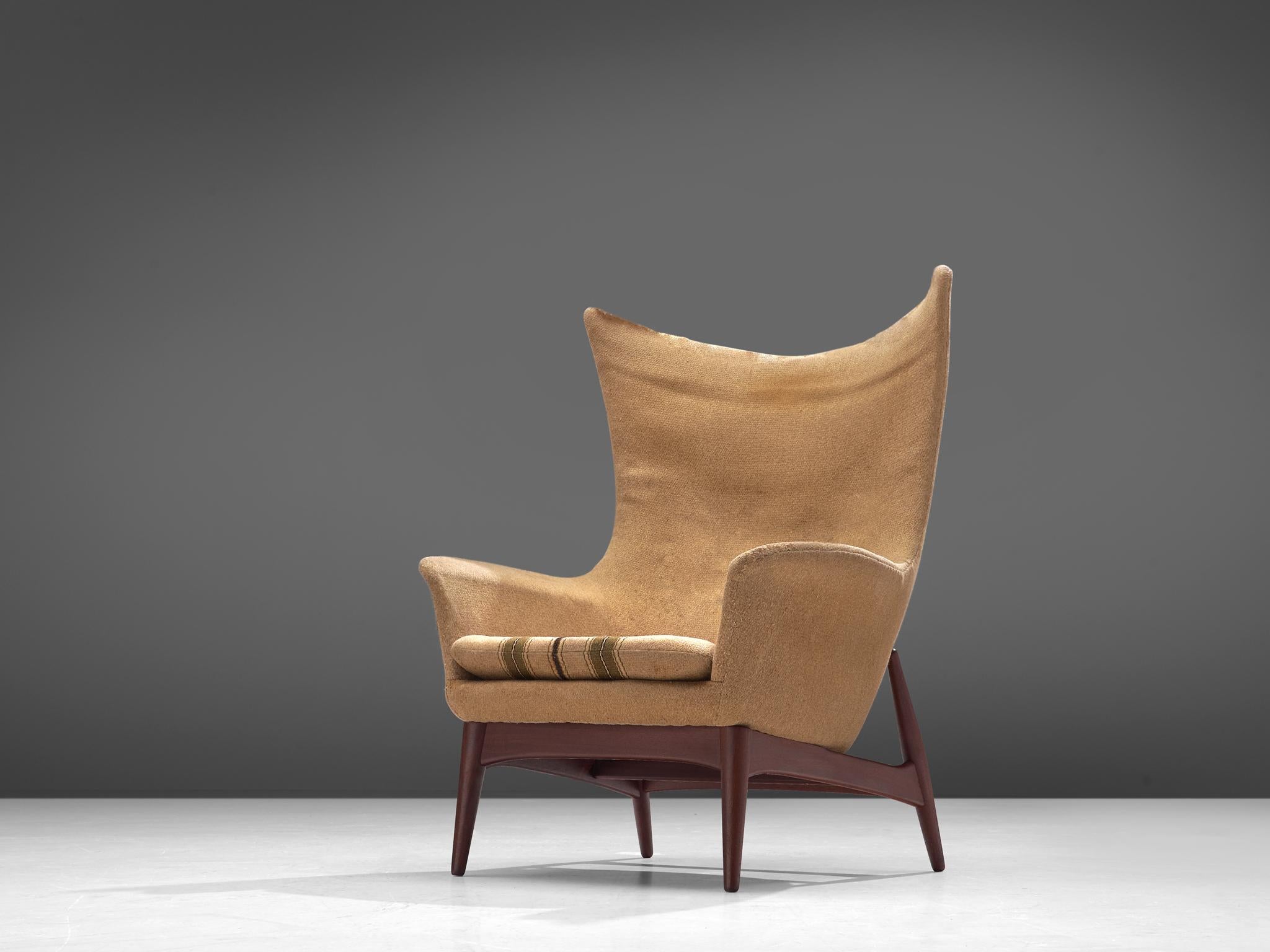 Egg lounge chair, attributed to H.W. Klein, fabric and teak, Denmark, 1960s

Sculptural lounge chair attributed to Henry Walter Klein. This wingback chair is a wonderful example of Scandinavian design, featuring a high, shell inspired backrest that