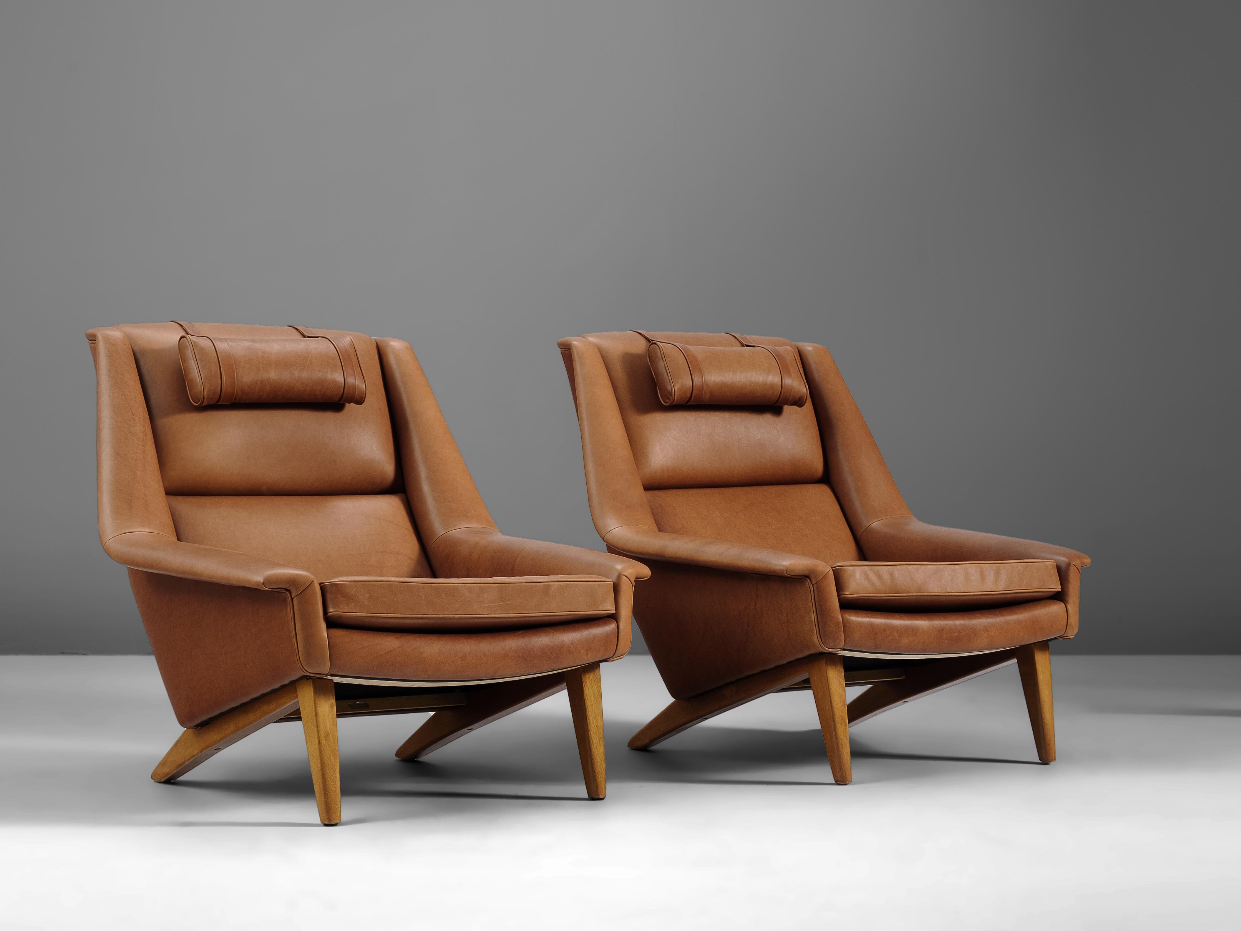 Folke Ohlsson for Fritz Hansen, lounge chairs, in any preferred leather of fabric, teak, Denmark, designed in 1957

These high quality made lounge chairs are made to reach an ultimate level of comfort as can clearly be recognized in the design.