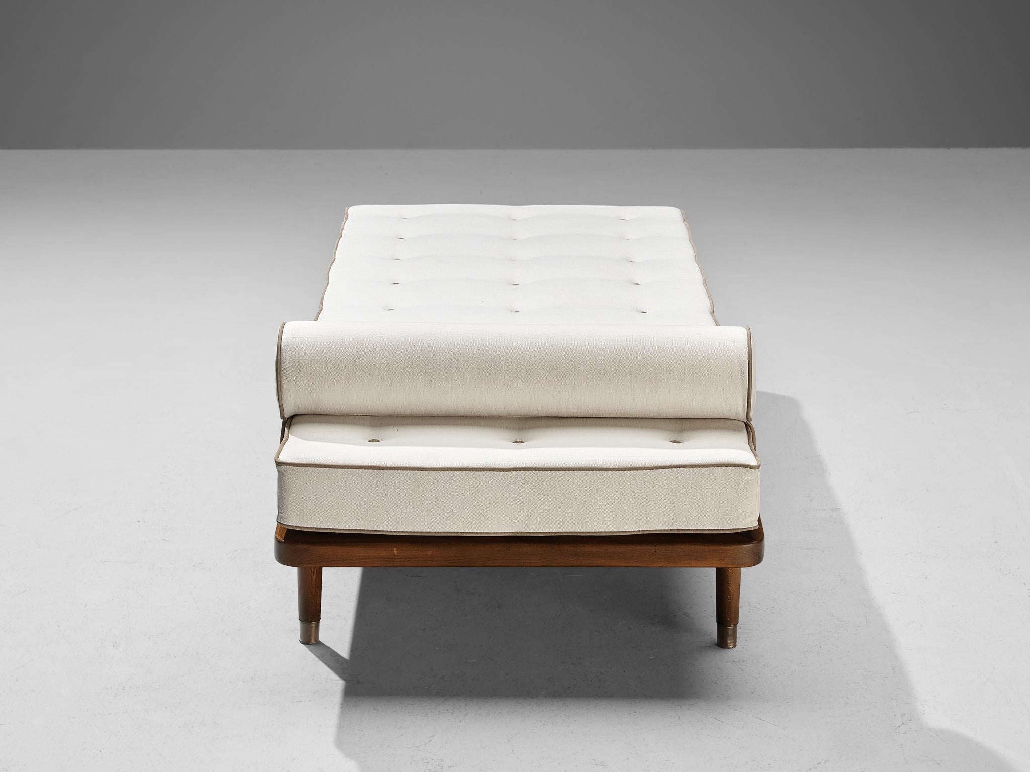 Daybed, beech, brass, Denmark, 1950s

A simple and minimalist bed designed in line with the Scandinavian Modern Design principles. With its clean and uncluttered look, the wooden framework takes center stage. It is based on clear lines with subtle