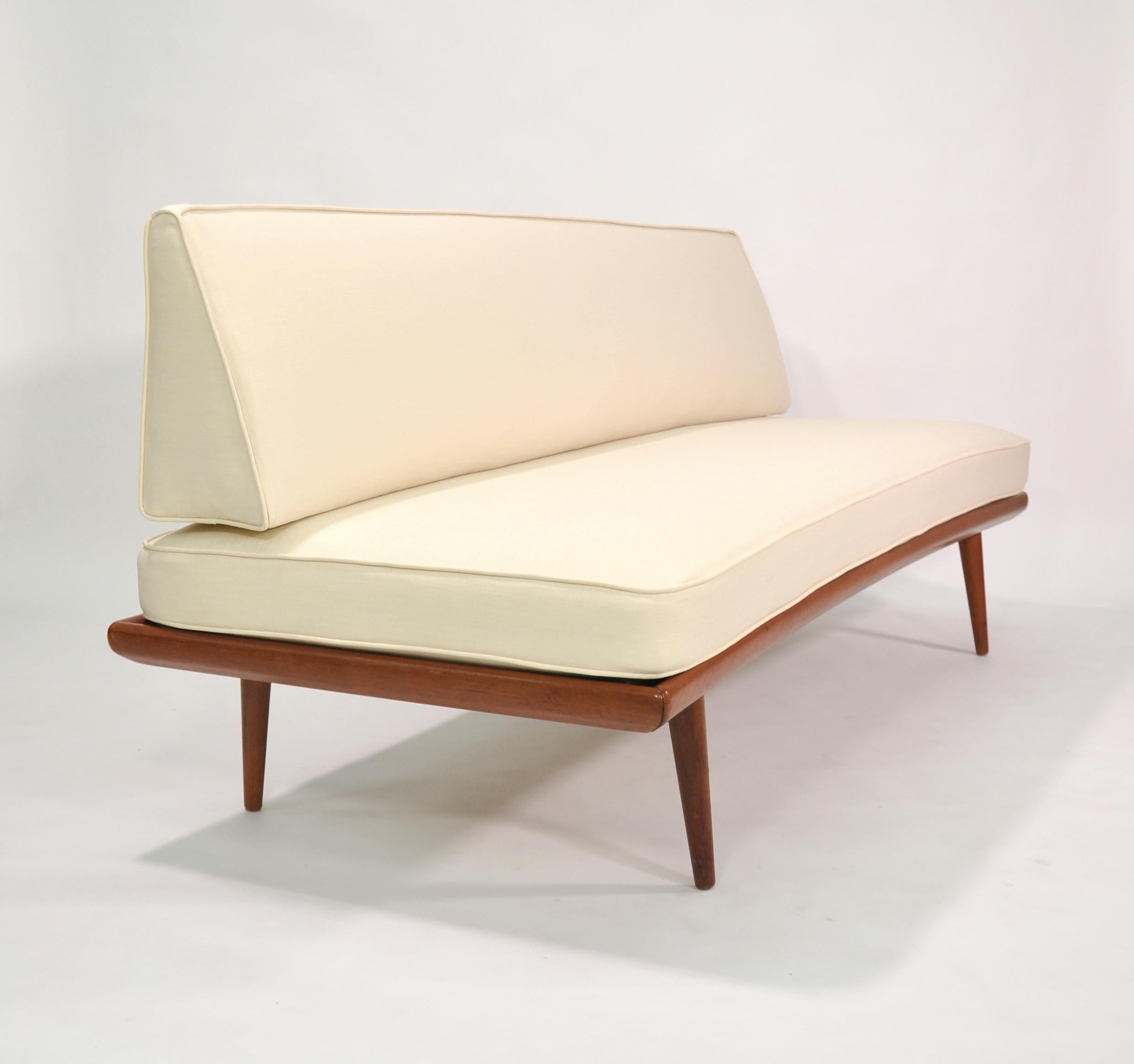 This Minerva FD 417 sofa was designed by Peter Hvidt & Orla Mølgaard-Nielsen and produced in the 1950s by France & Daverkosen (later renamed France & Son) in Denmark. It is made of solid teak and features new upholstery in a a beautiful earth tone