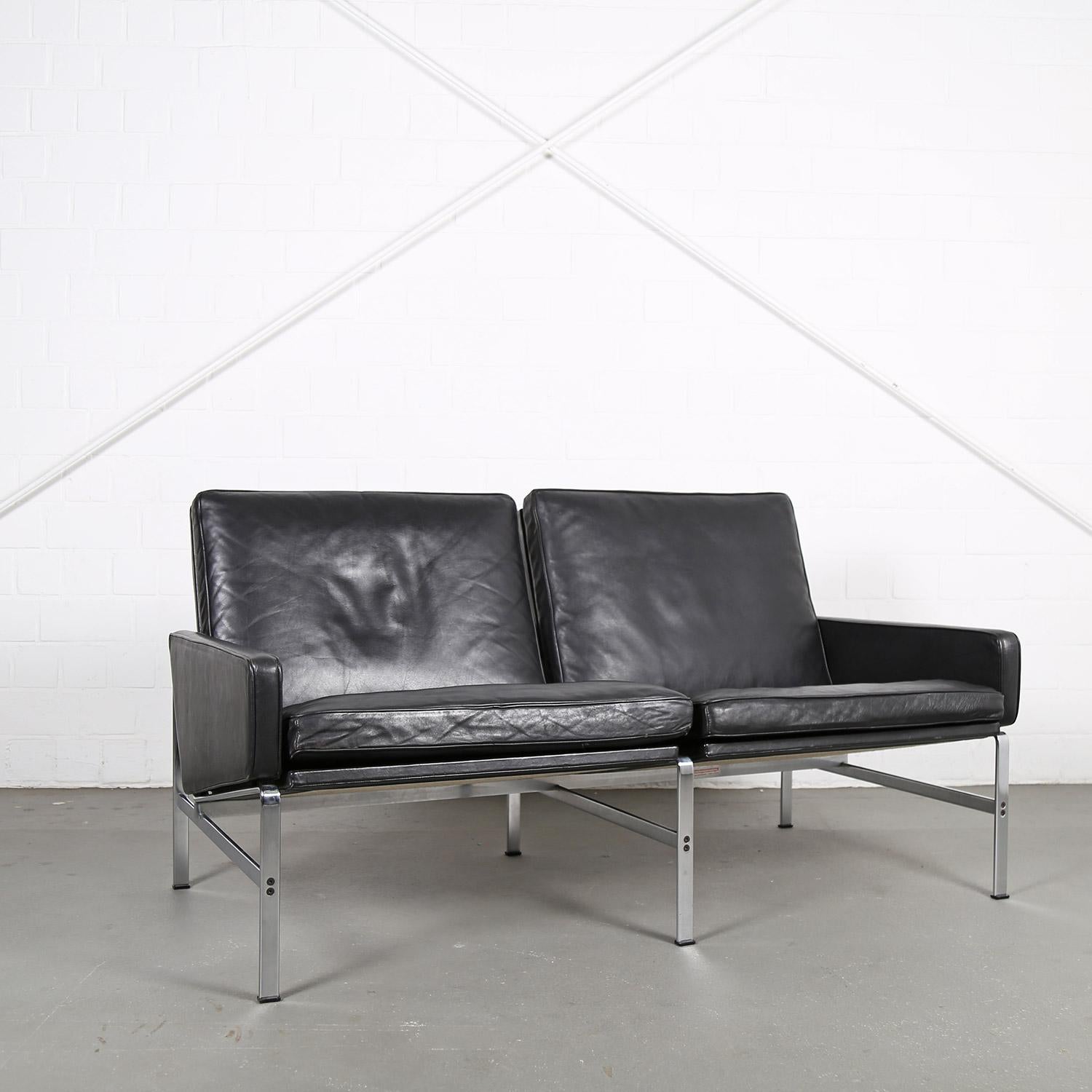 Danish leather 2-seater sofa model FK6722 designed by Preben Fabricius and Jørgen Kastholm for Kill International in the 60s. Heavy quality and unique processing consisting of high-quality materials. Two matching armchairs also